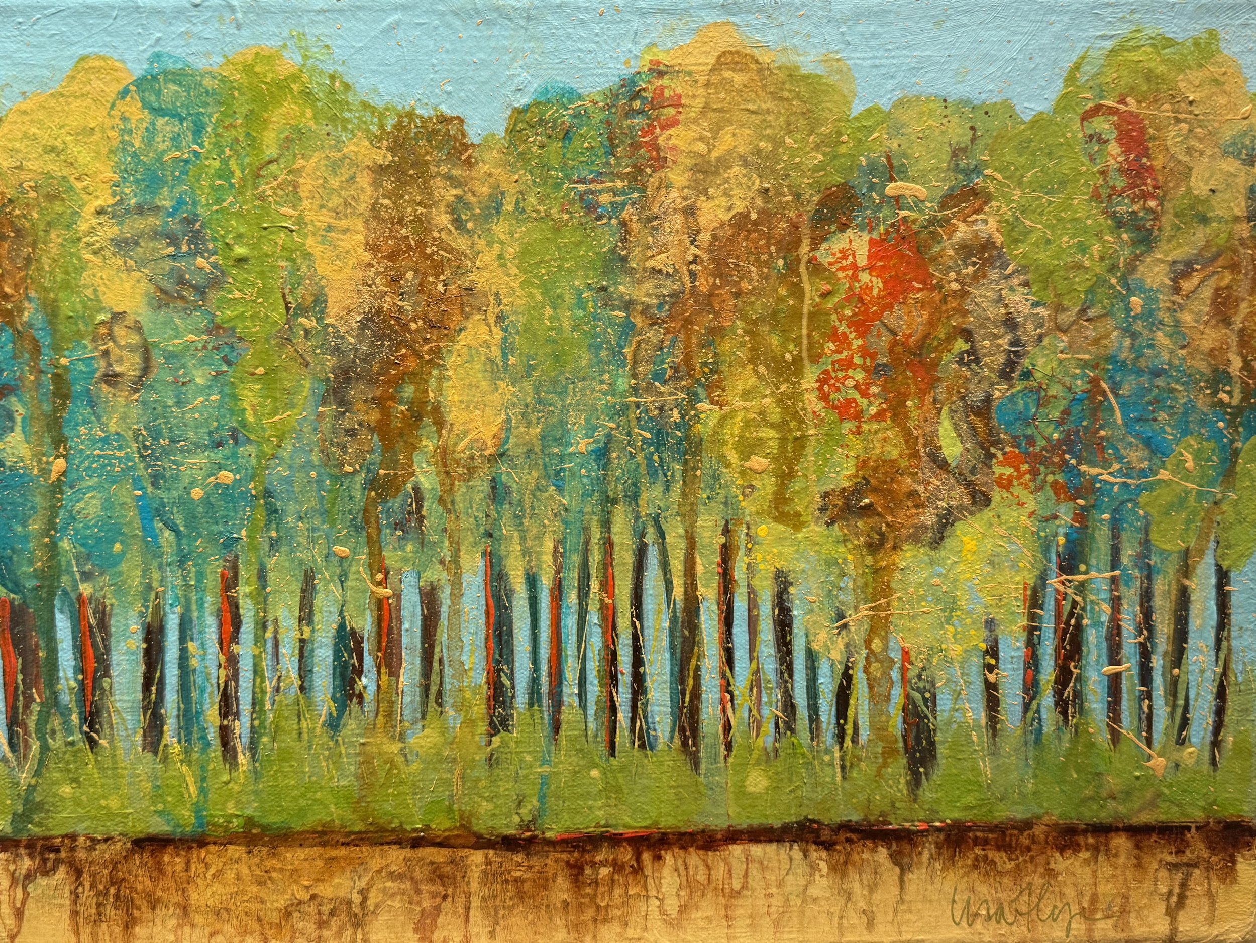 Abstract painting of a forest with trees in green, yellow, red, and brown colors, with a blue sky background and textured surface.