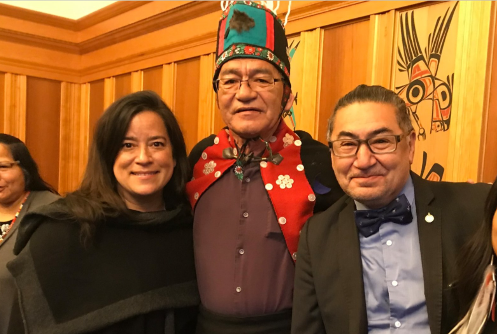 Chief John Ridsdale poses for a photo next to Jody Wilson Raybould. Ridsdale has reportedly been charged with four crimes after executing a dog with a gun late at night.