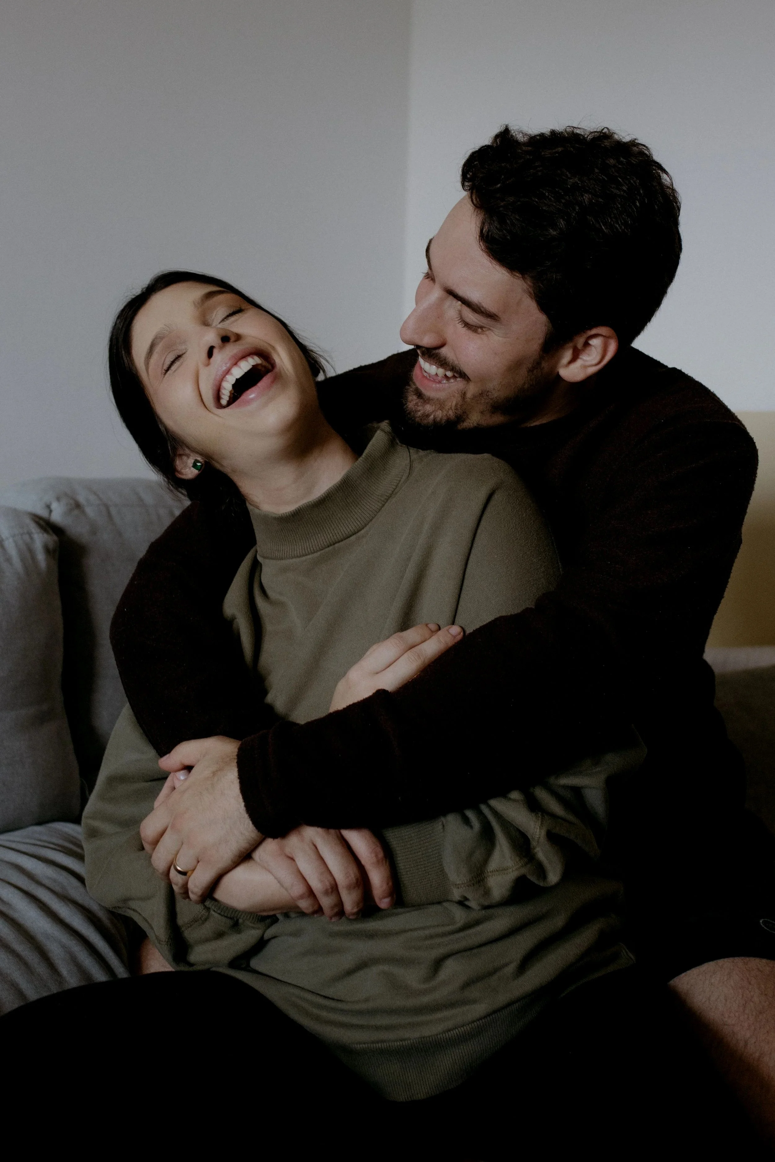 Couple sharing a relaxed moment together after rebuilding connection.