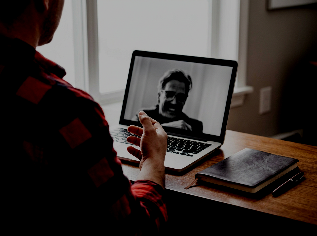 Person attending an online counselling session from home.