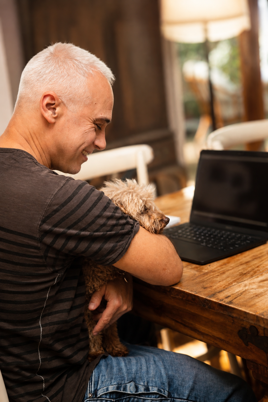 Uri Bookman reflecting with his dog beside him, representing curiosity, learning and personal growth.
