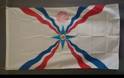 Assyria large flag on grey wall.jpg