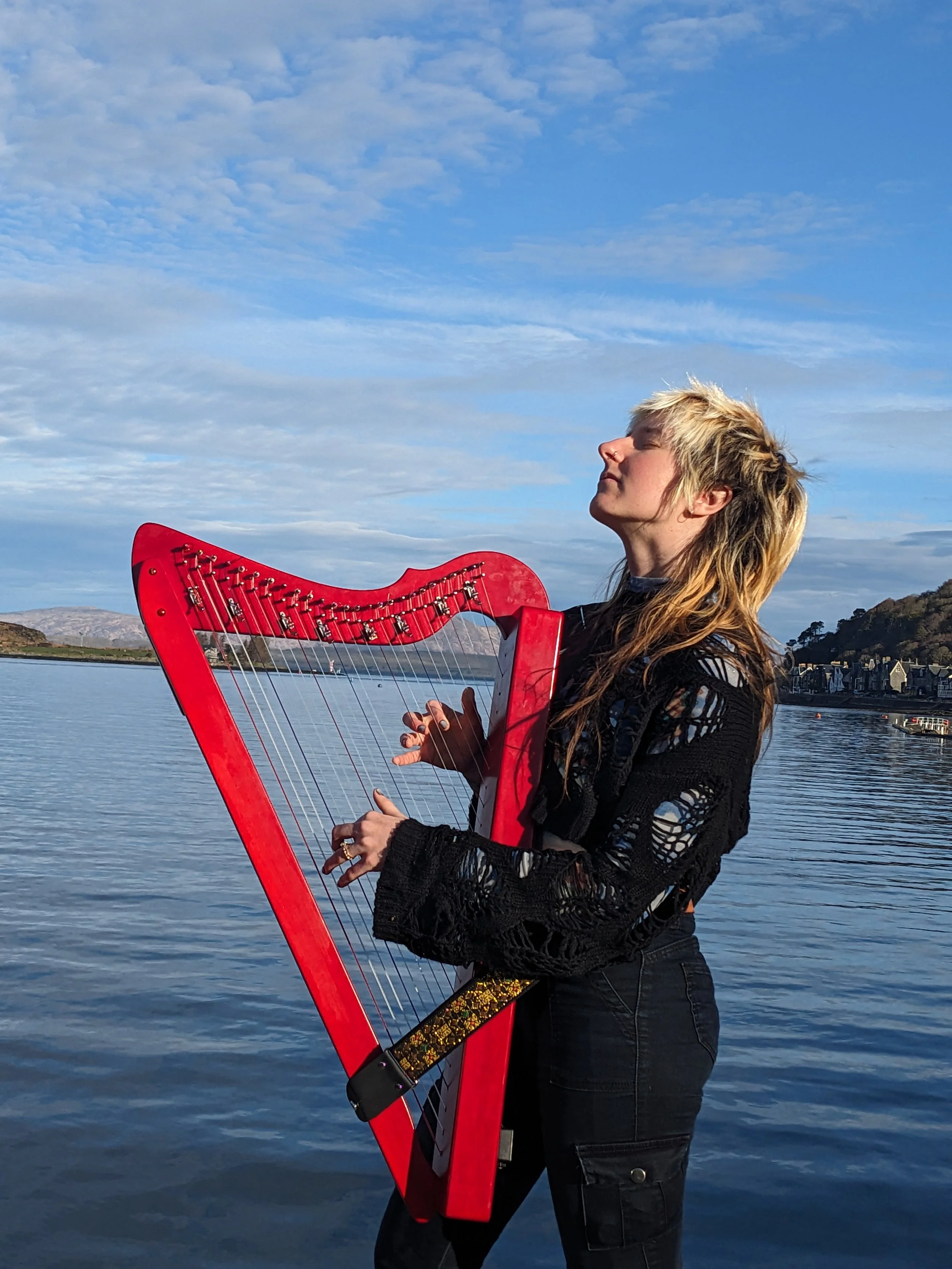 Busking on the docks of beautiful Oban, Scotland