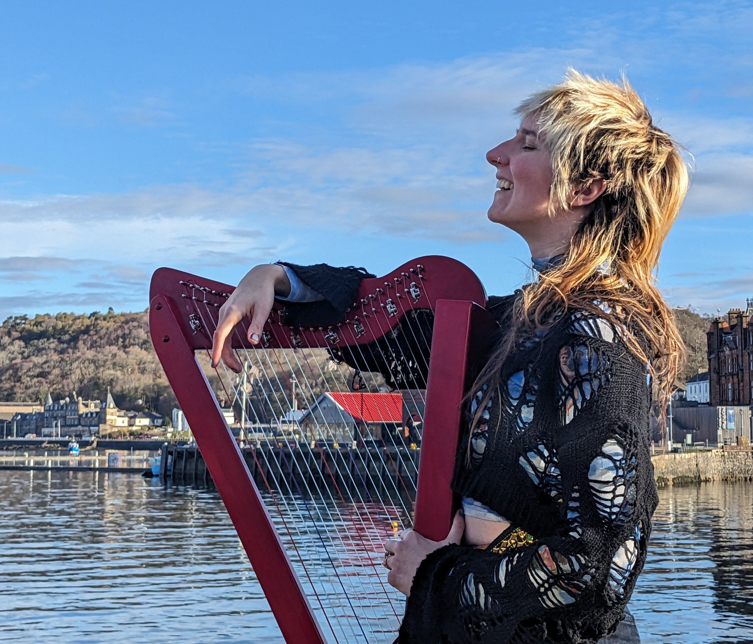 Busking on the docks of beautiful Oban, Scotland
