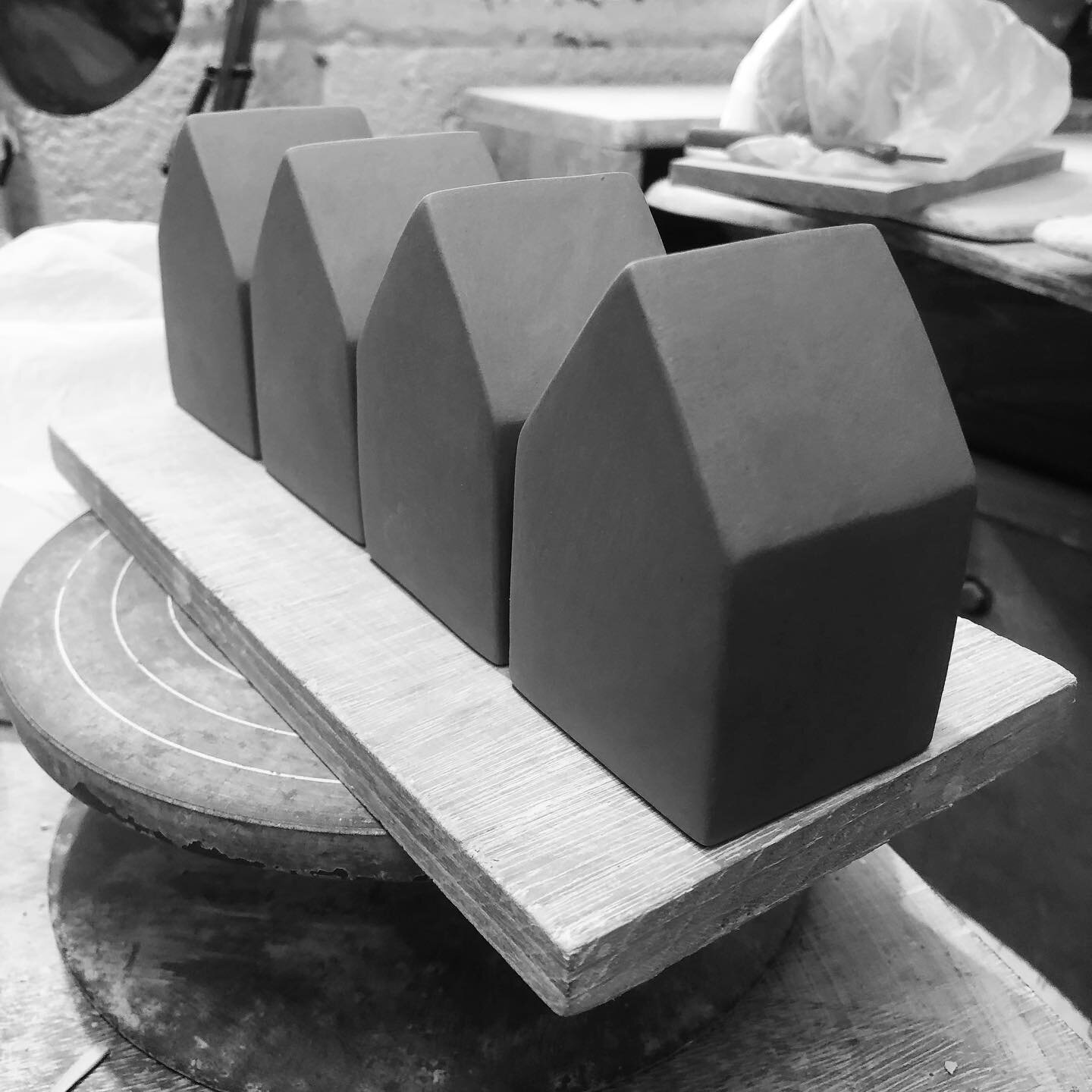 A row of  hollow houses on my workshop table today .