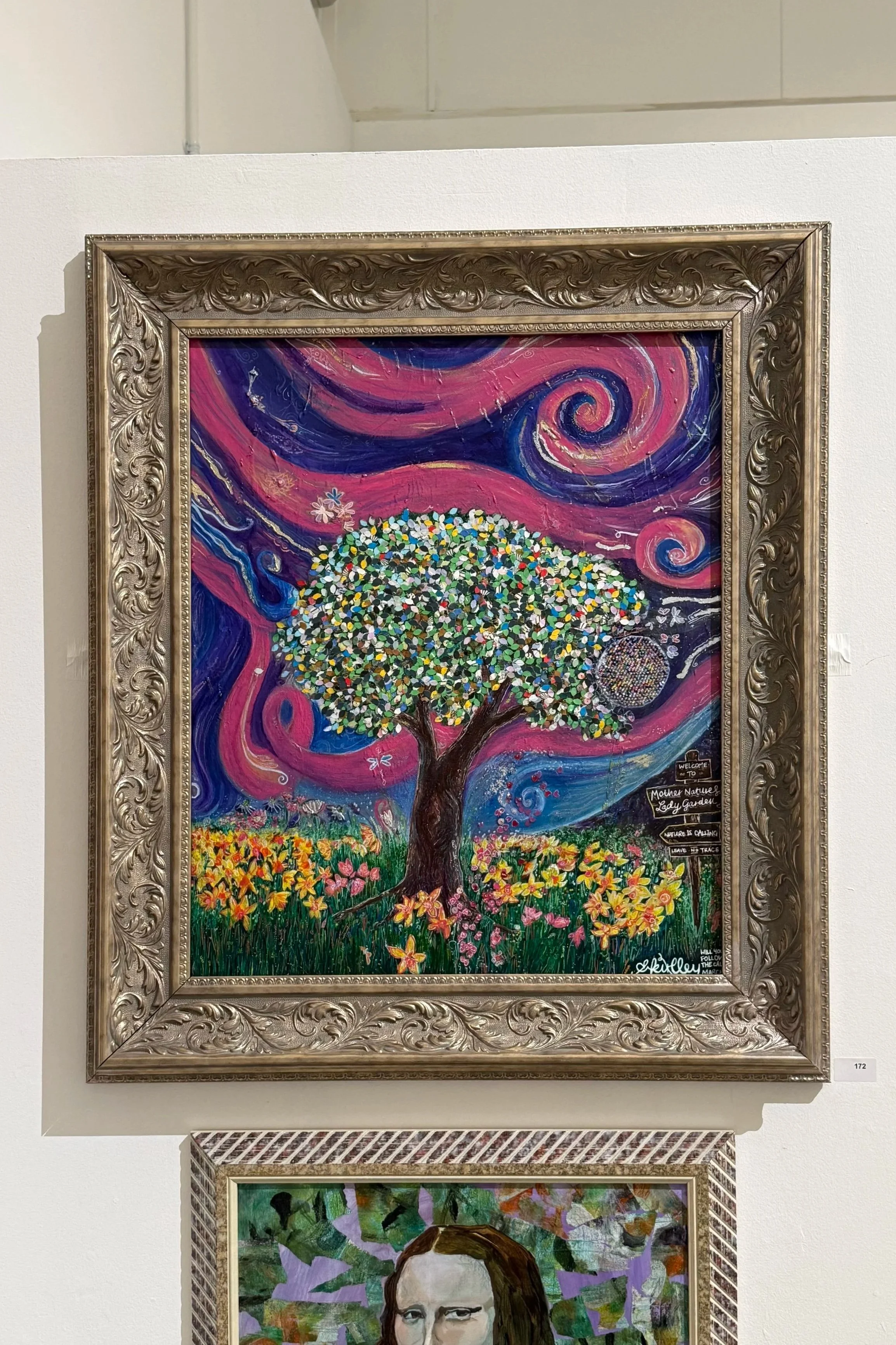 Painting of a colorful tree with swirling pink and purple sky, surrounded by flowers in a decorative frame.