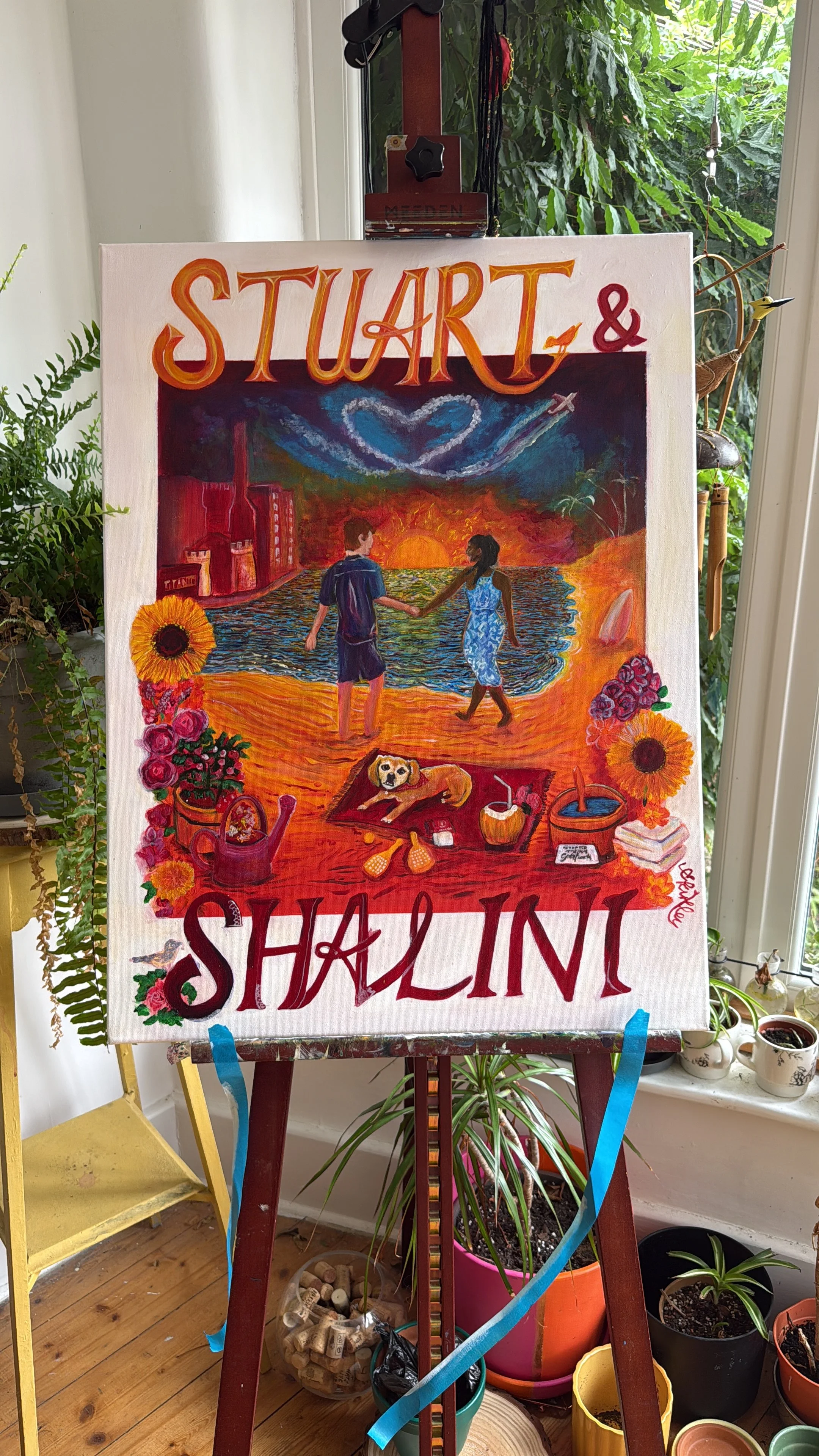 Colorful painting on an easel depicting two people holding hands on a beach at sunset, surrounded by flowers, a dog, and various objects in a vibrant style.
