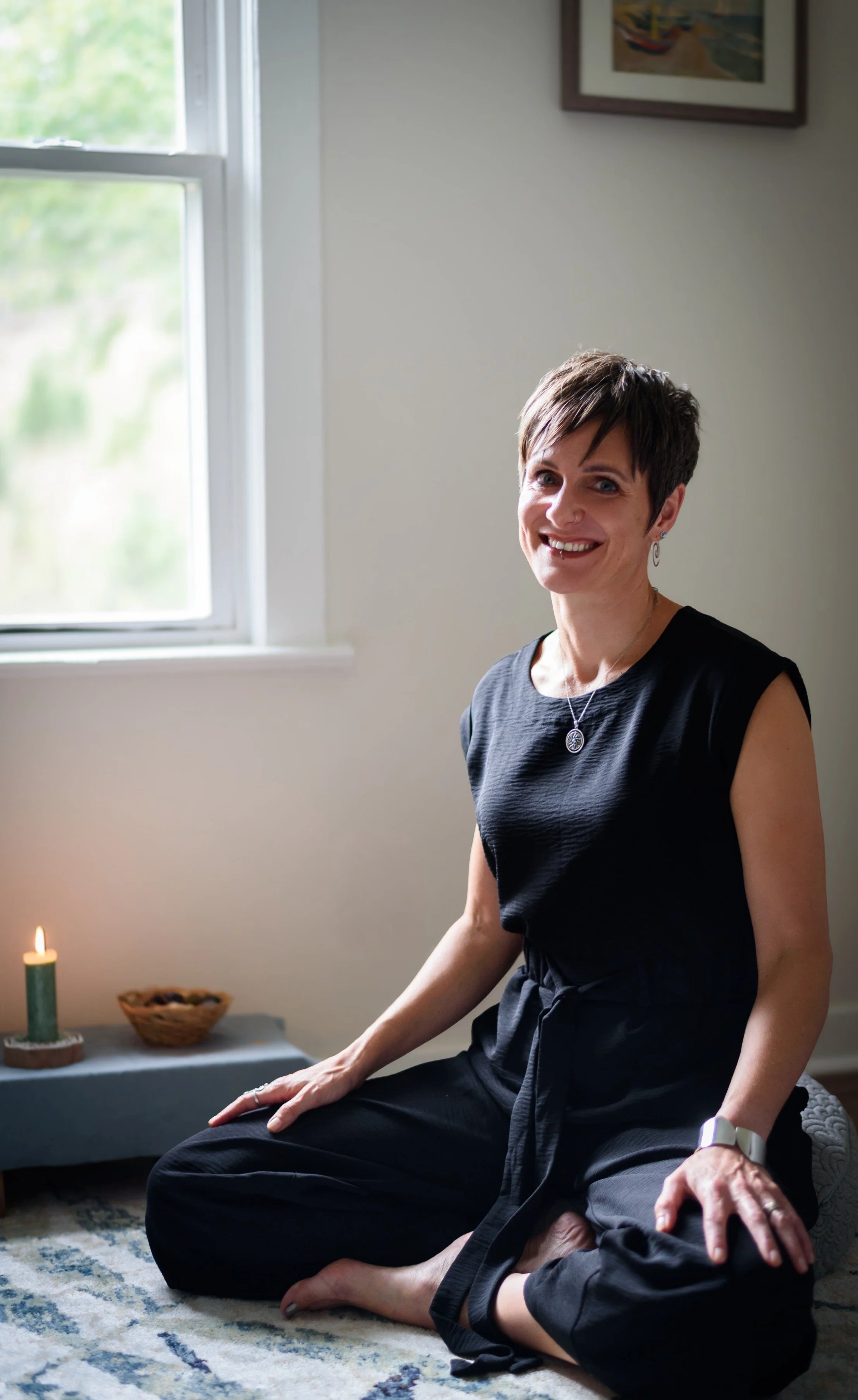 Cornelia Scott practicing yoga as part of her somatic and embodiment-based approach.