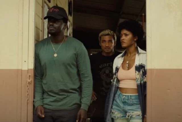 OJ, Emerald, and Angel of Jordan Peele's Nope stand in a doorway.