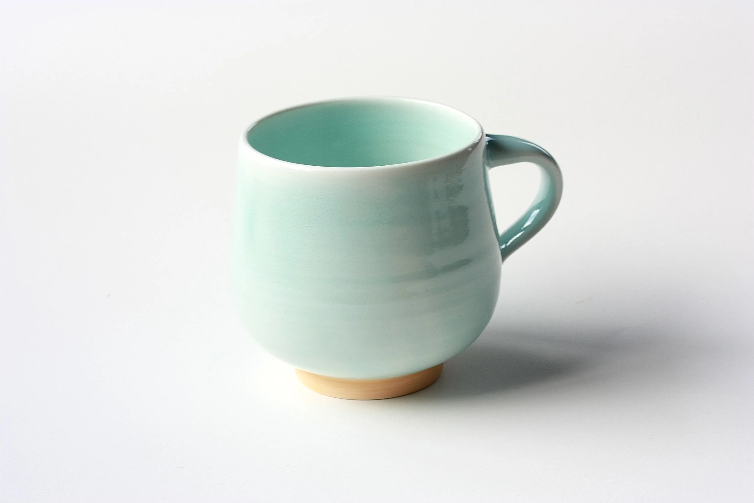 Porcelain cup, orange foot