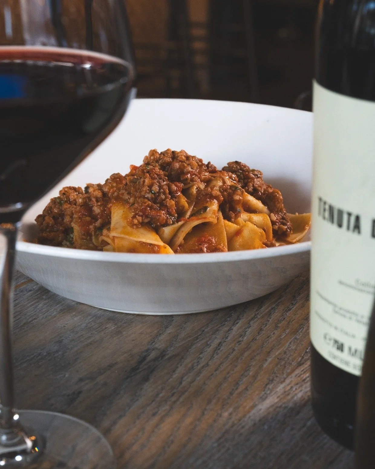 This weather calls for a comforting bowl of Pappardelle Bolognese and a glass of red.