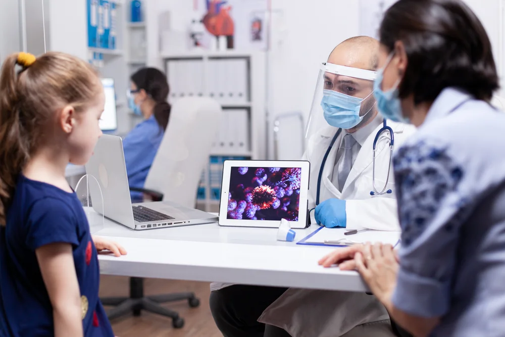 doctor-showing-how-virus-attaks-immune-system-CJHSEK6.JPG