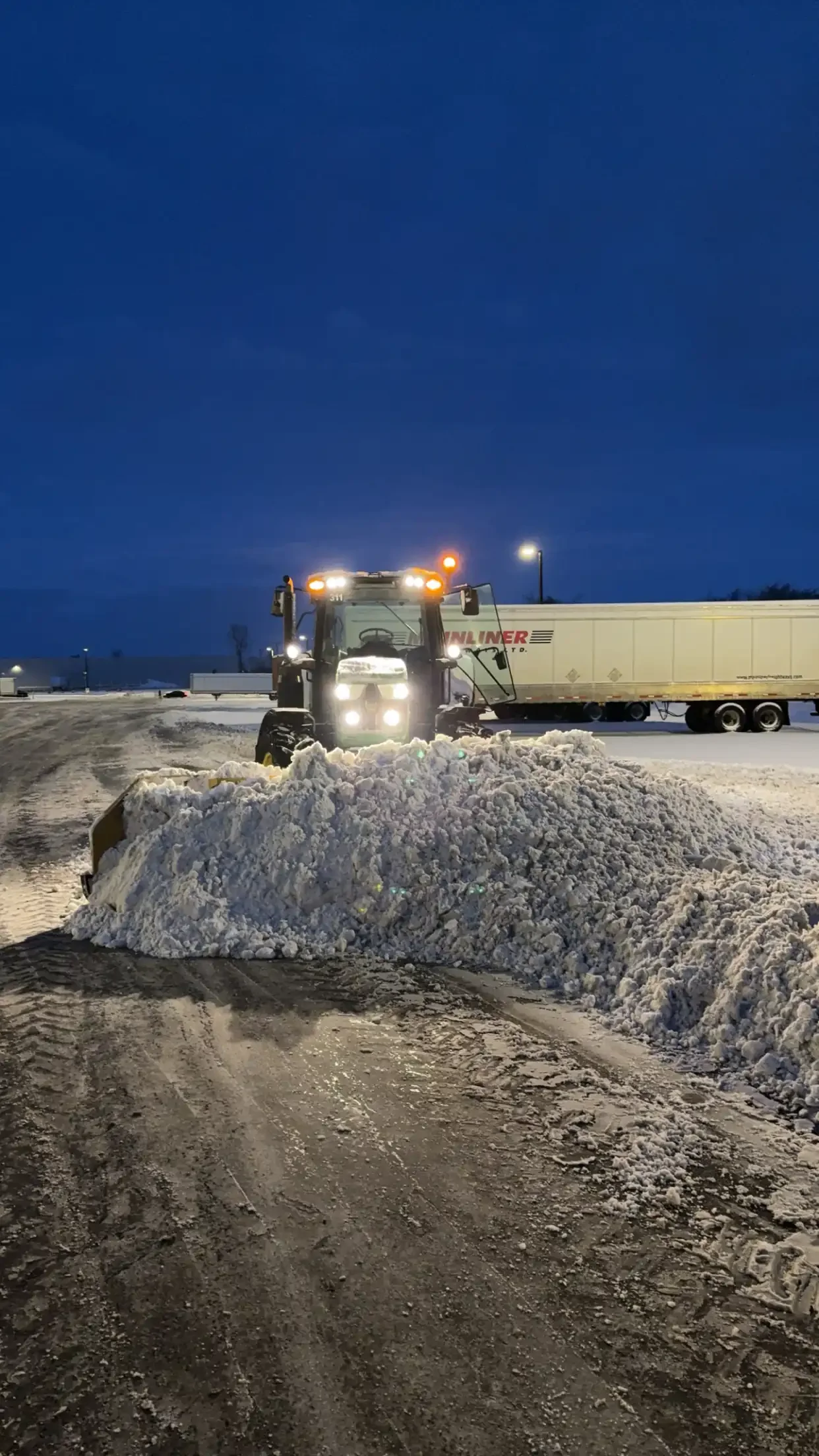 Commercial snow removal with a tractor in Elora