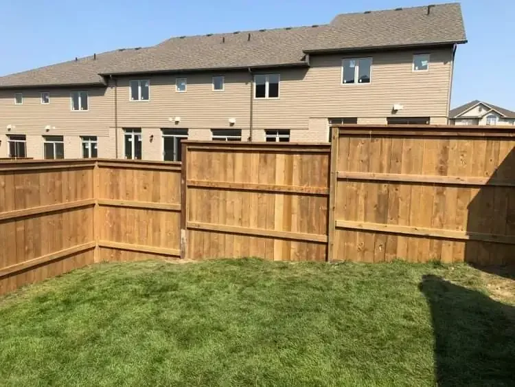 New pressure treated fence installed by Brothers Landscaping in a new subdivision in Guelph, Ontario
