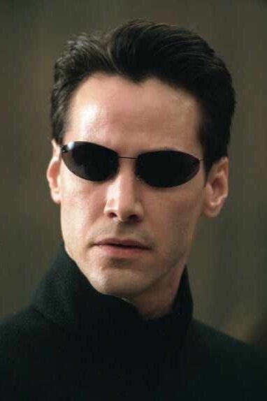 Neo's skinny black sunglasses