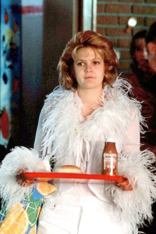 Drew Barrymore wearing a white outfit in Never Been Kissed