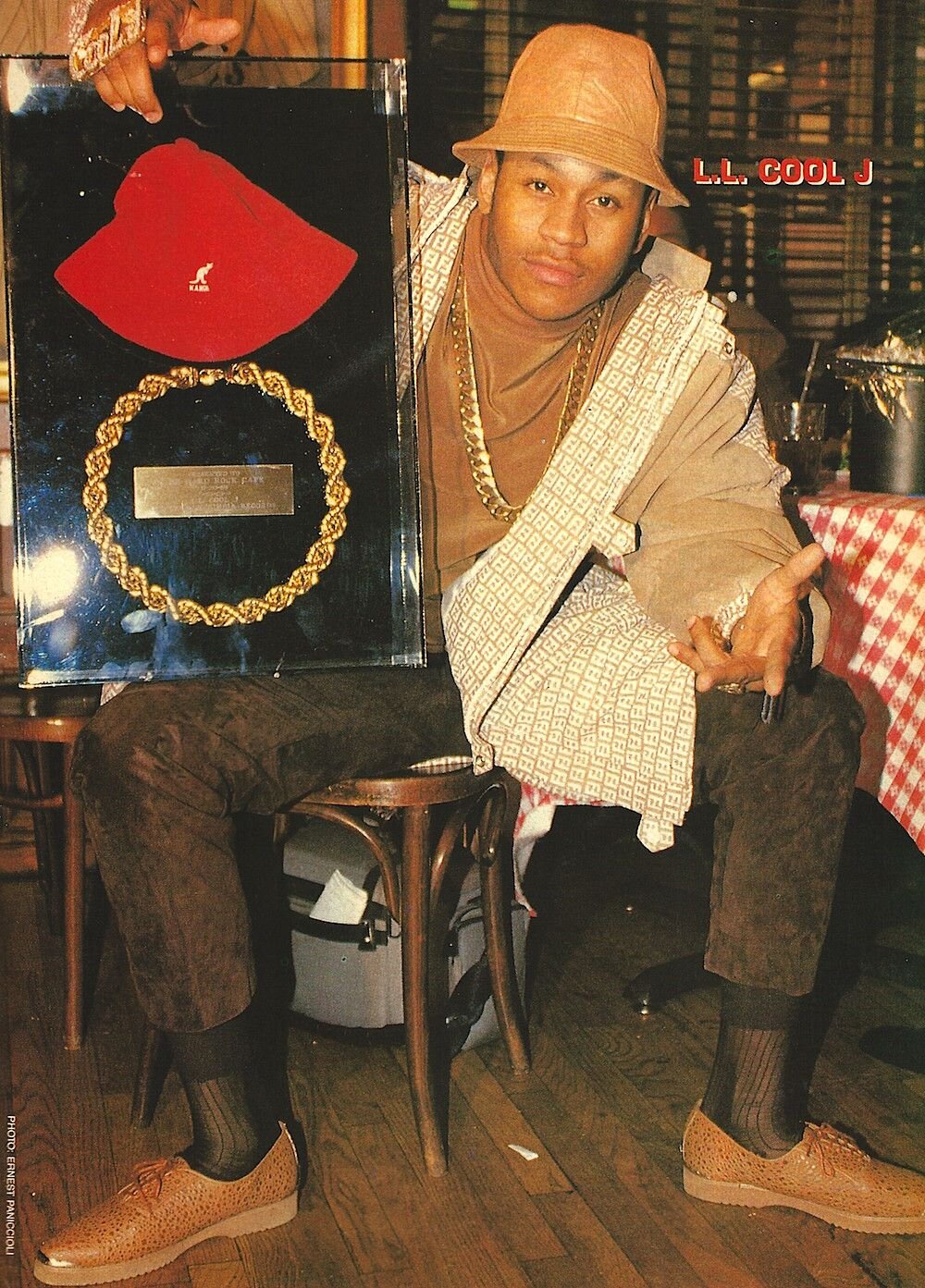 LL Cool J poses with his iconic red Kangol hat