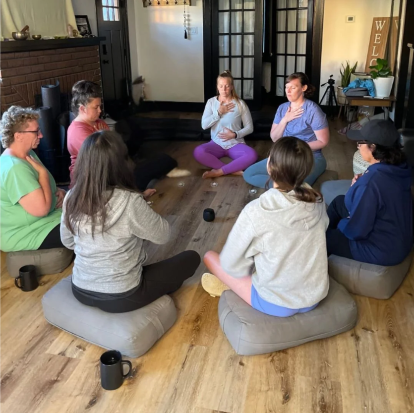 Women sitting in a meditation circle.