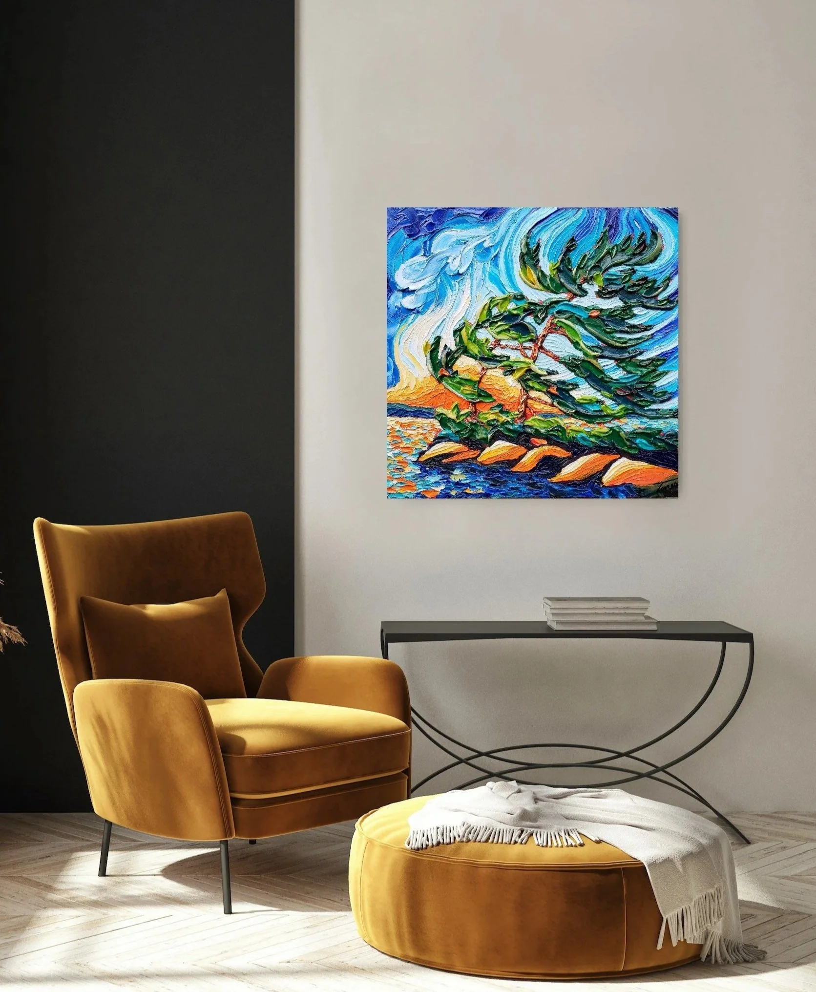 A modern living room with a mustard yellow armchair and matching round ottoman with a white blanket. There is a black metal console table with books underneath a colorful painting of a windswept tree on a vibrant landscape.