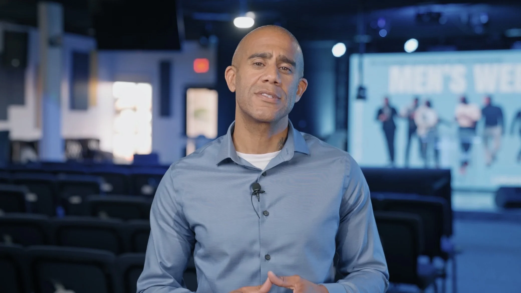 man wearing blue in promotional video