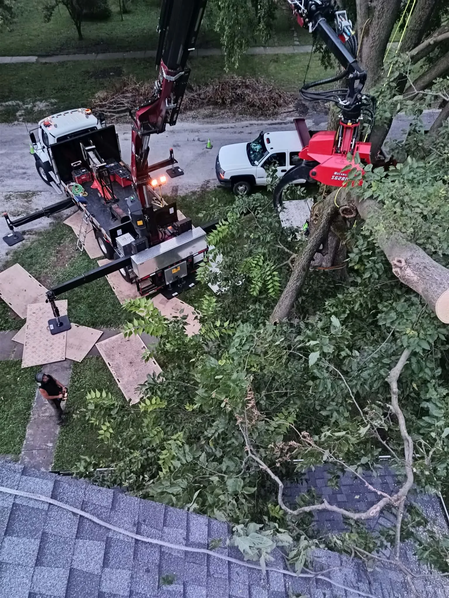 Aerial view of emergency tree service with knuckleboom crane