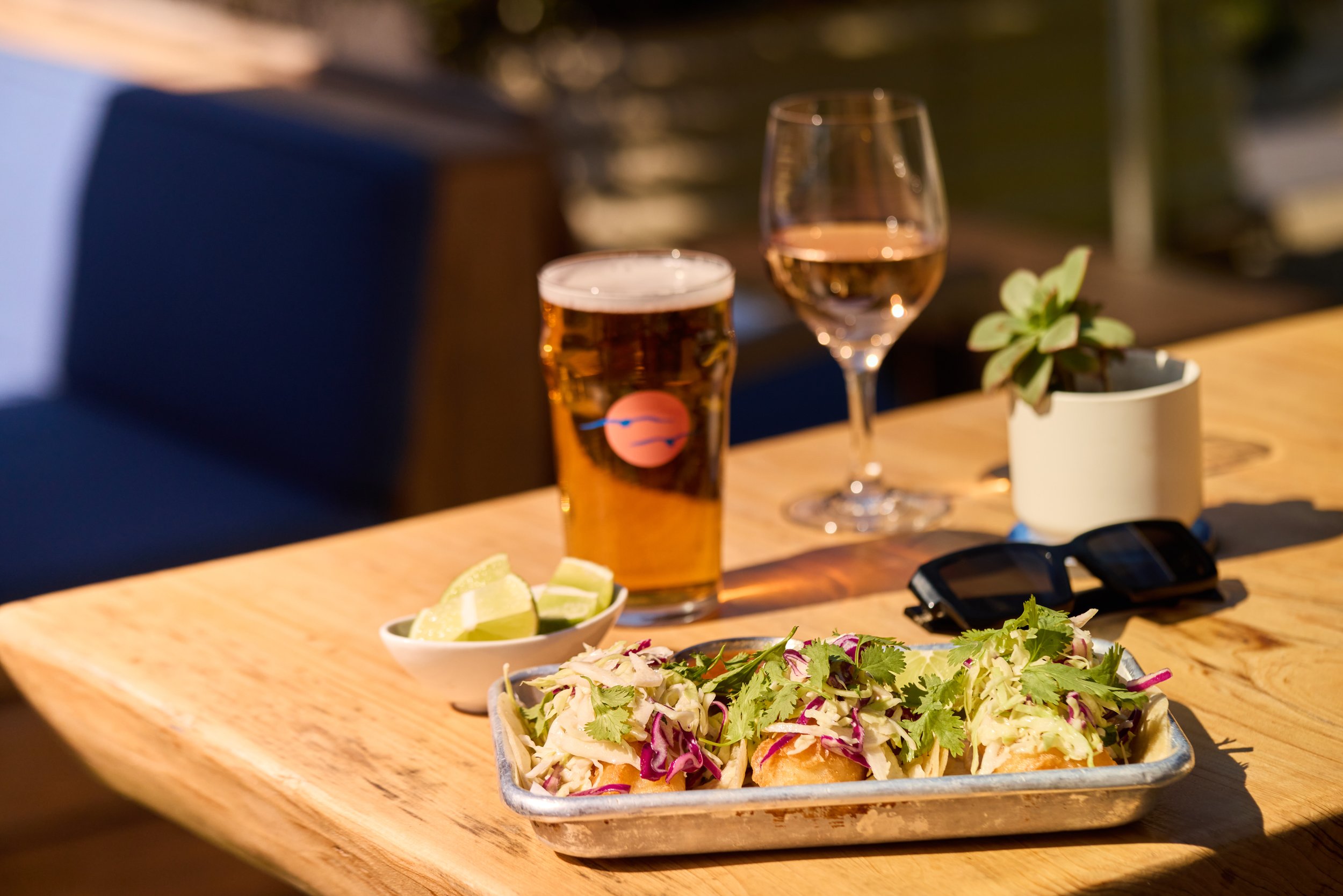 Our delicious Baja Fish Tacos are served on flour tortillas with fried cod, coleslaw, and chipotle crema.