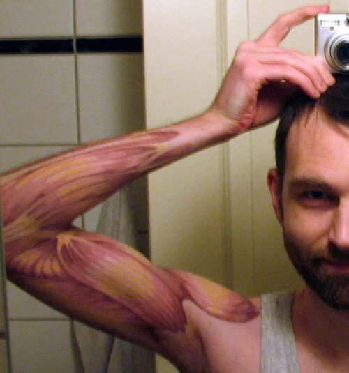 Full-Arm Muscle Tattoo