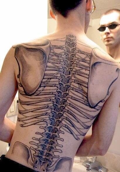 Micro-realistic smoking skeleton tattoo located on the