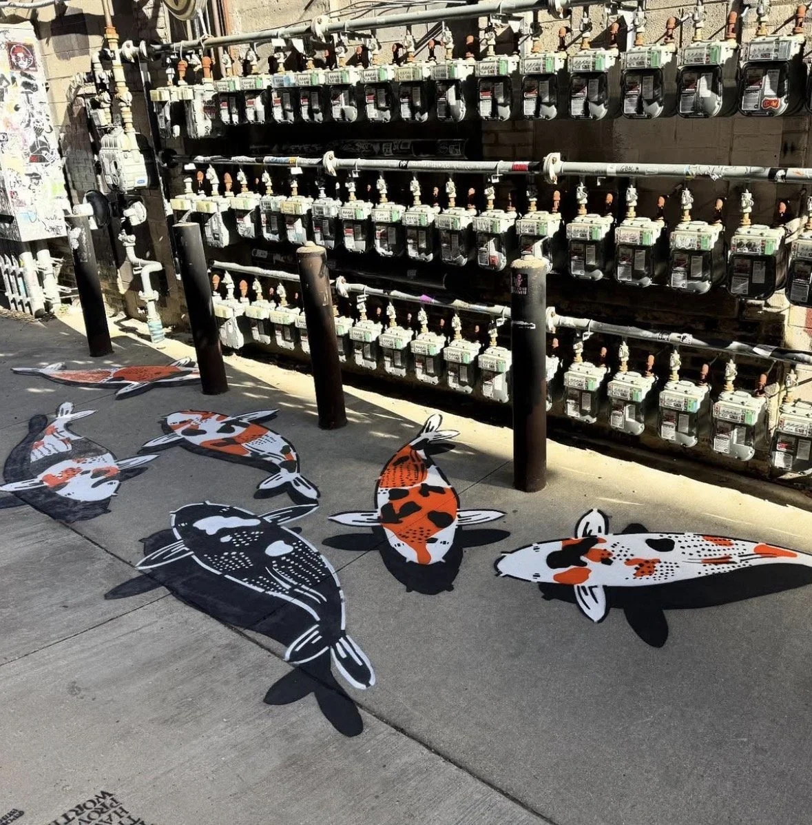 Jeremy Novy Returns to Black Cat Alley with an Updated "Koi" Ground Mural
