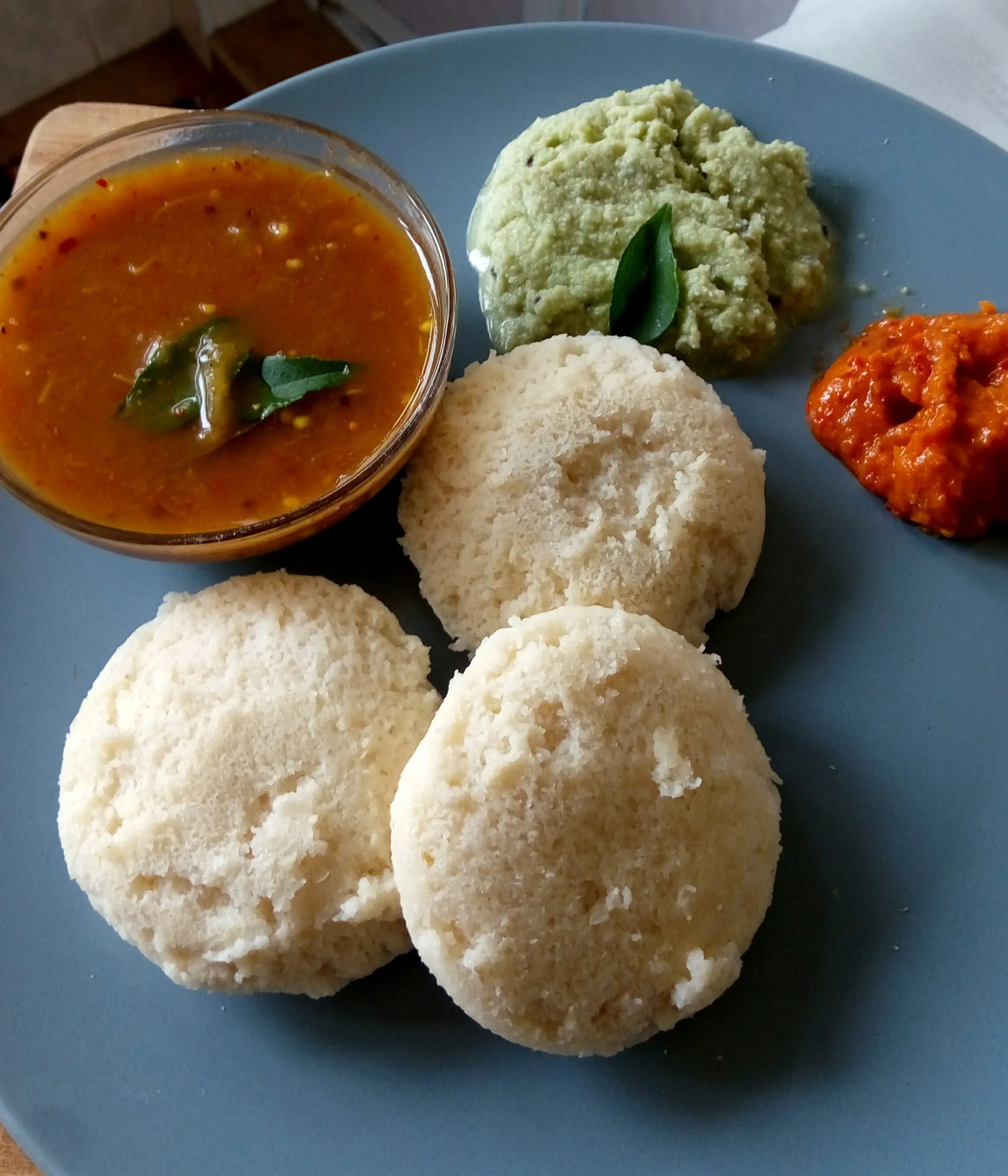 Traditional South Indian Brinjal Gothsu served with Pongalor idlis