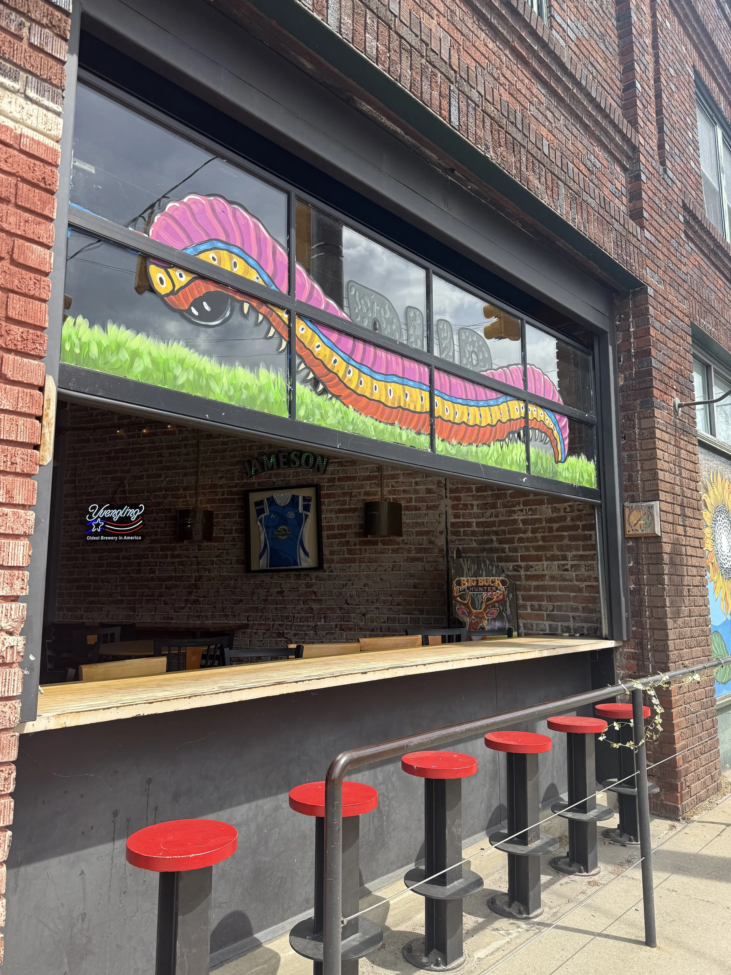 Dog friendly outdoor seating for people watching in Asheville