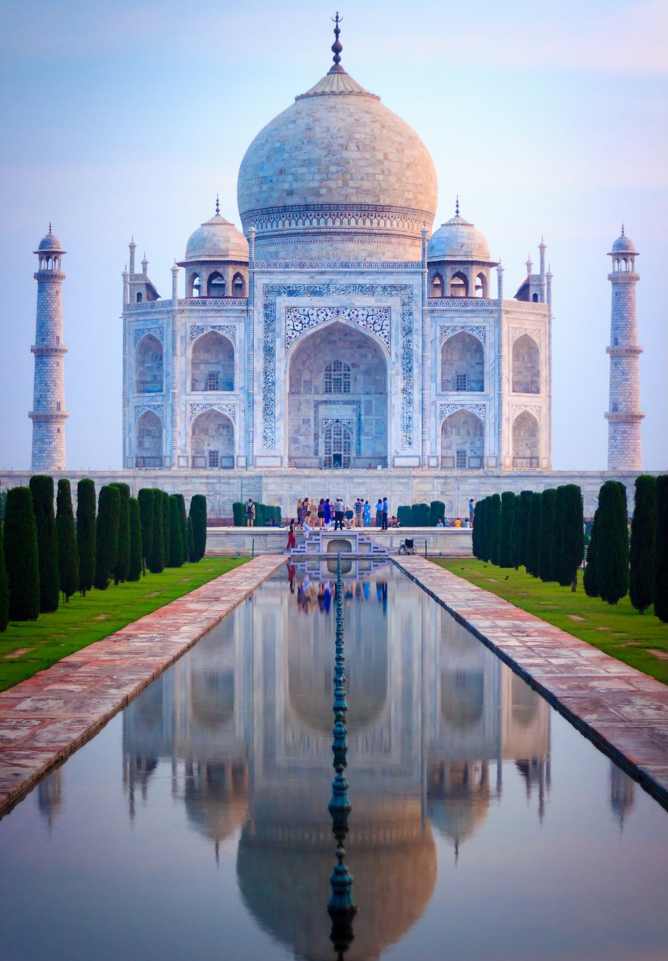 The Taj Mahal at sunrise. Photograph by Malpaniashutosh, Wikimedia Commons.