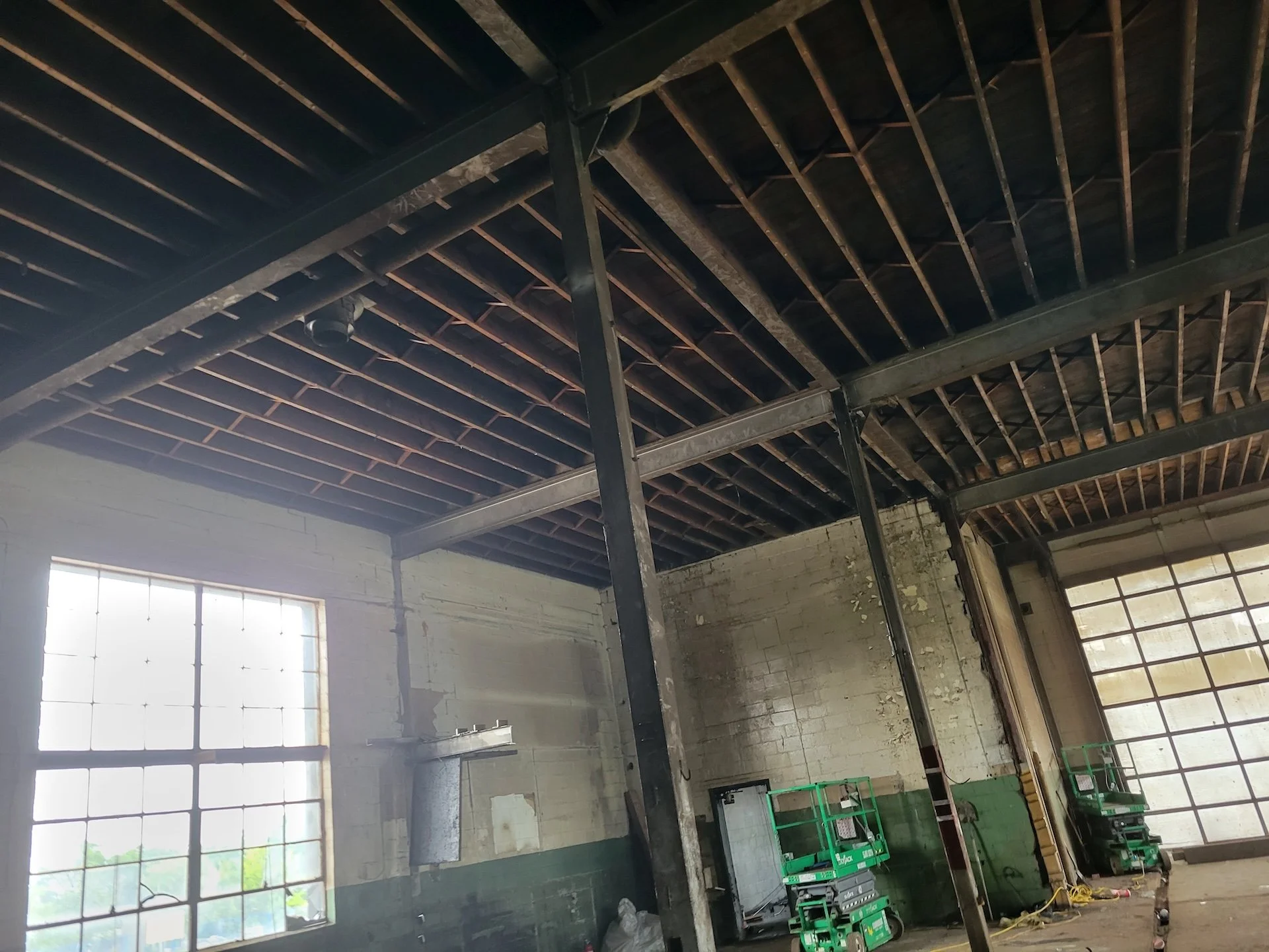 The existing interior space photographed before its conversion in 2025.