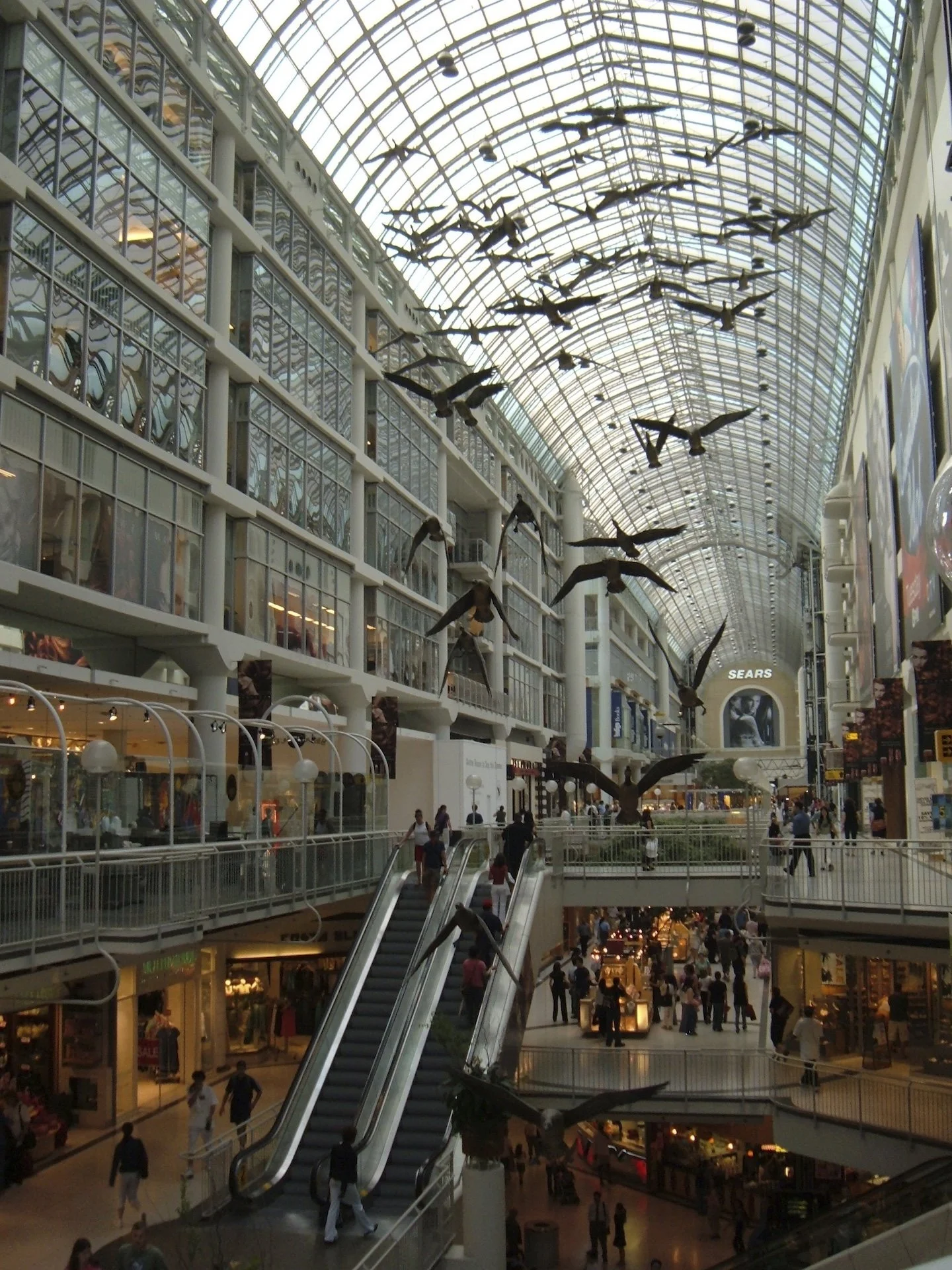 Interior of CF Toronto Eaton Centre beneath its glazed roof.