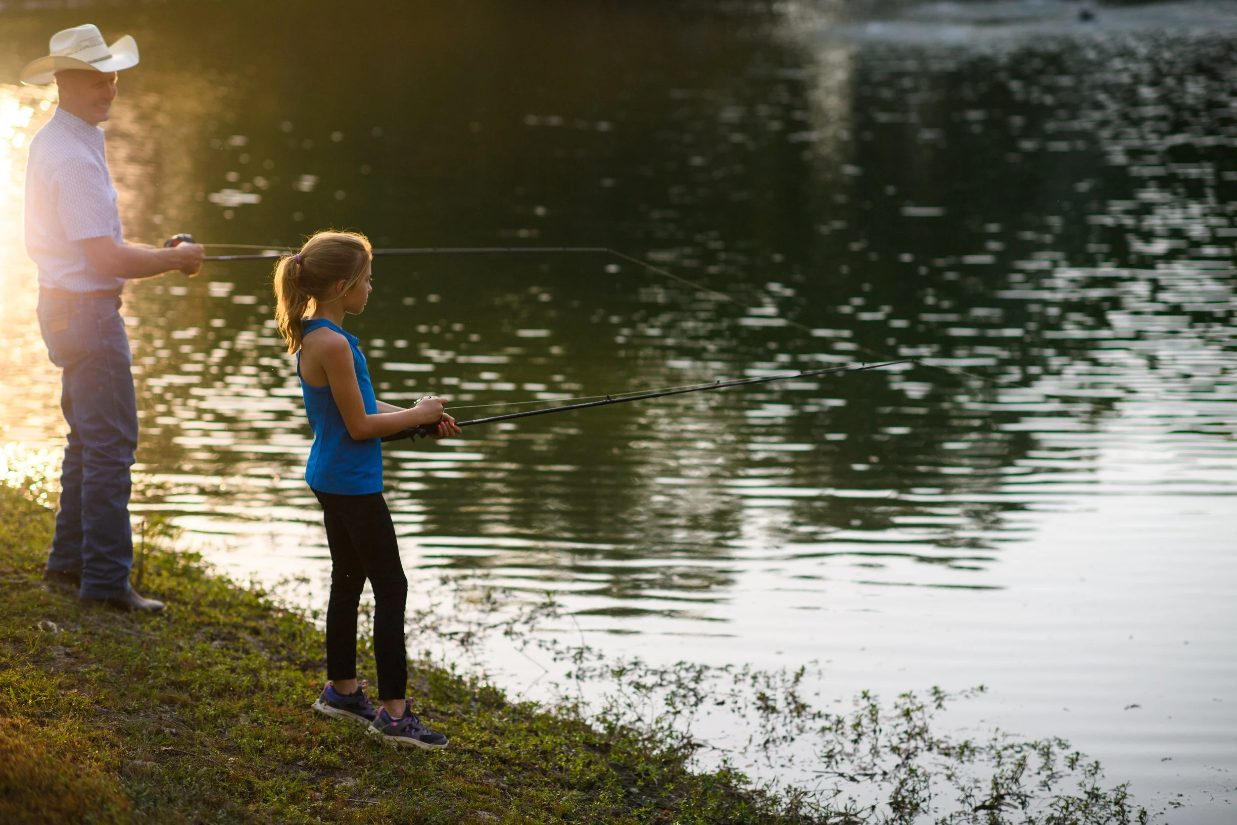 Family enjoying time together outdoors near the water