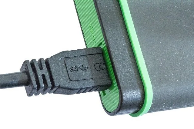 A simple USB Cable &amp; External Drive. Who doesn’t have a few of these laying around? FYI: they make an ideal option for this month’s tip on “backing up” files. Photo courtesy of pixabay.com