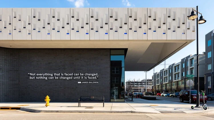 Greenwood Rising Black Wall Street History Center exterior in Tulsa, with its distinctive white upper facade and dark lower walls