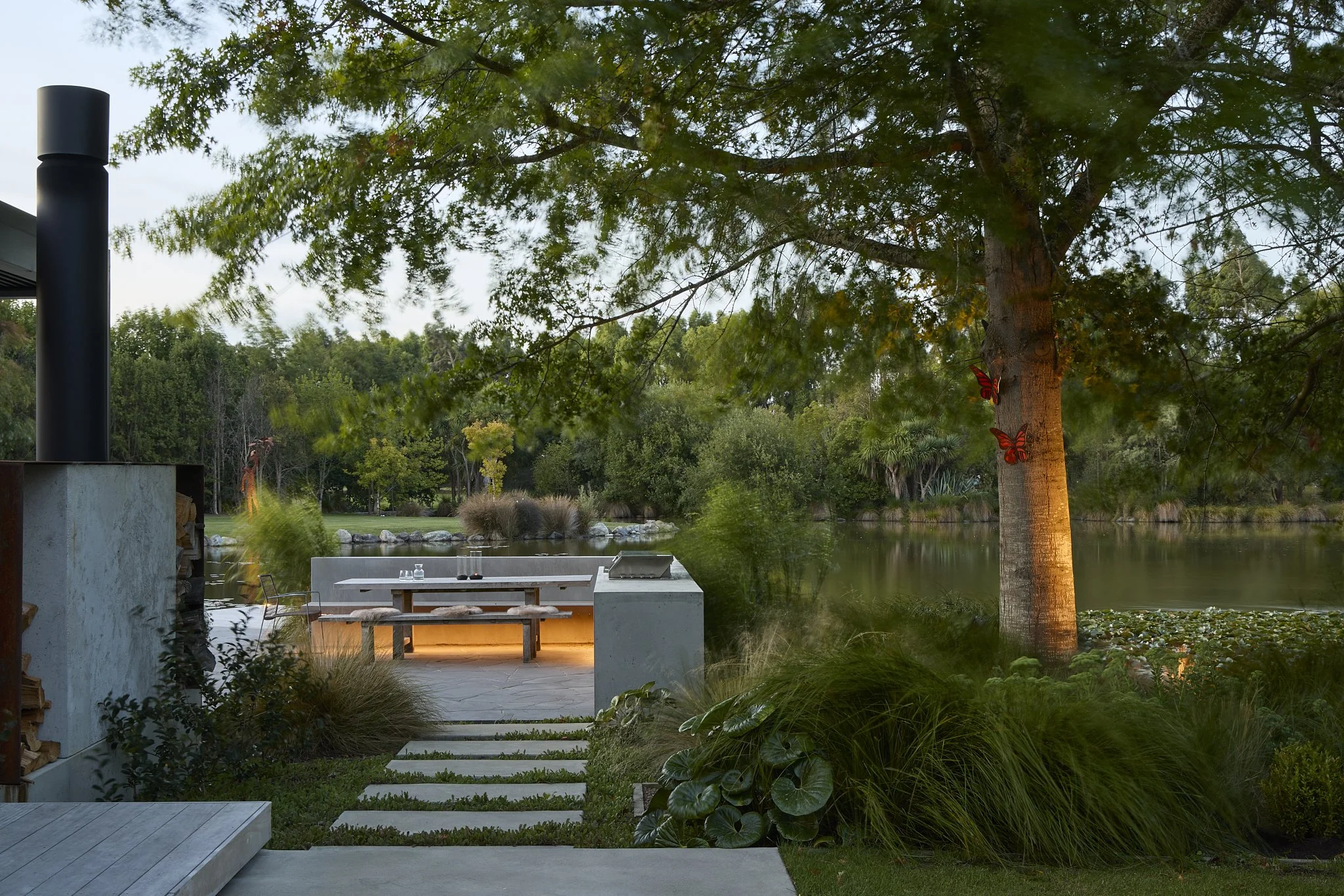 Tai Tapu home renovation beside tranquil pond at dusk