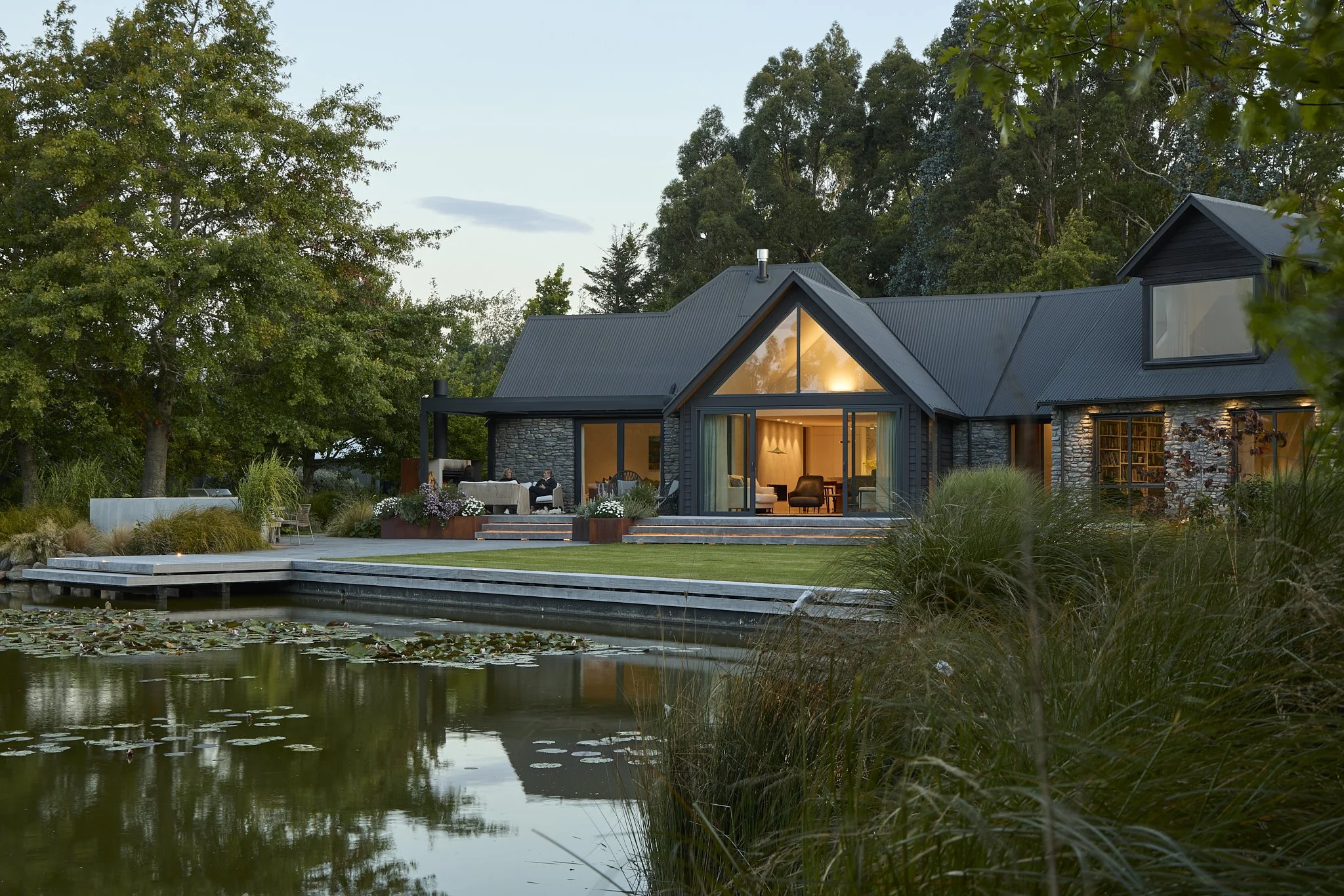 Garden terrace overlooking pond at Tai Tapu renovation