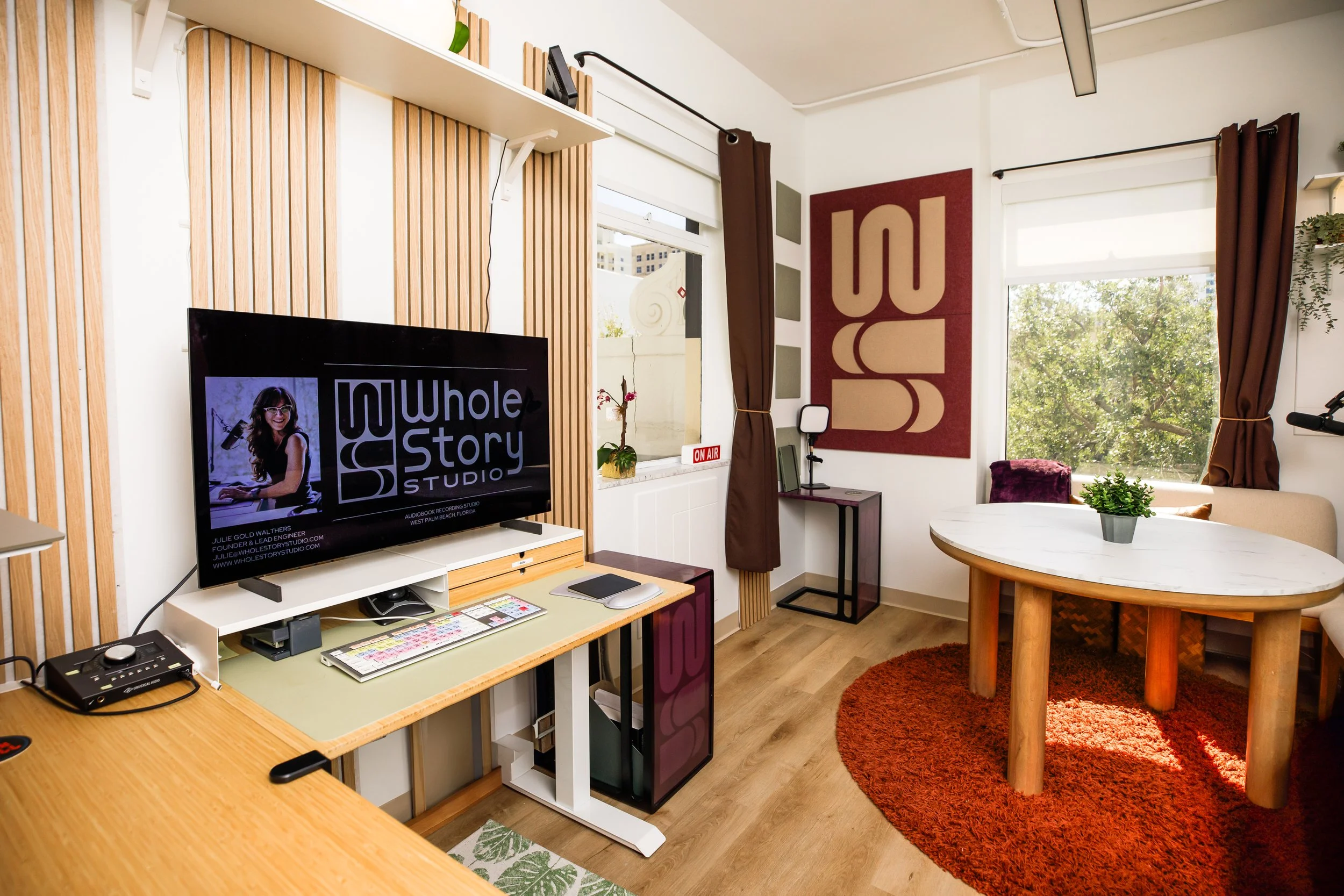 A desk with audio recording gear for audiobook recording