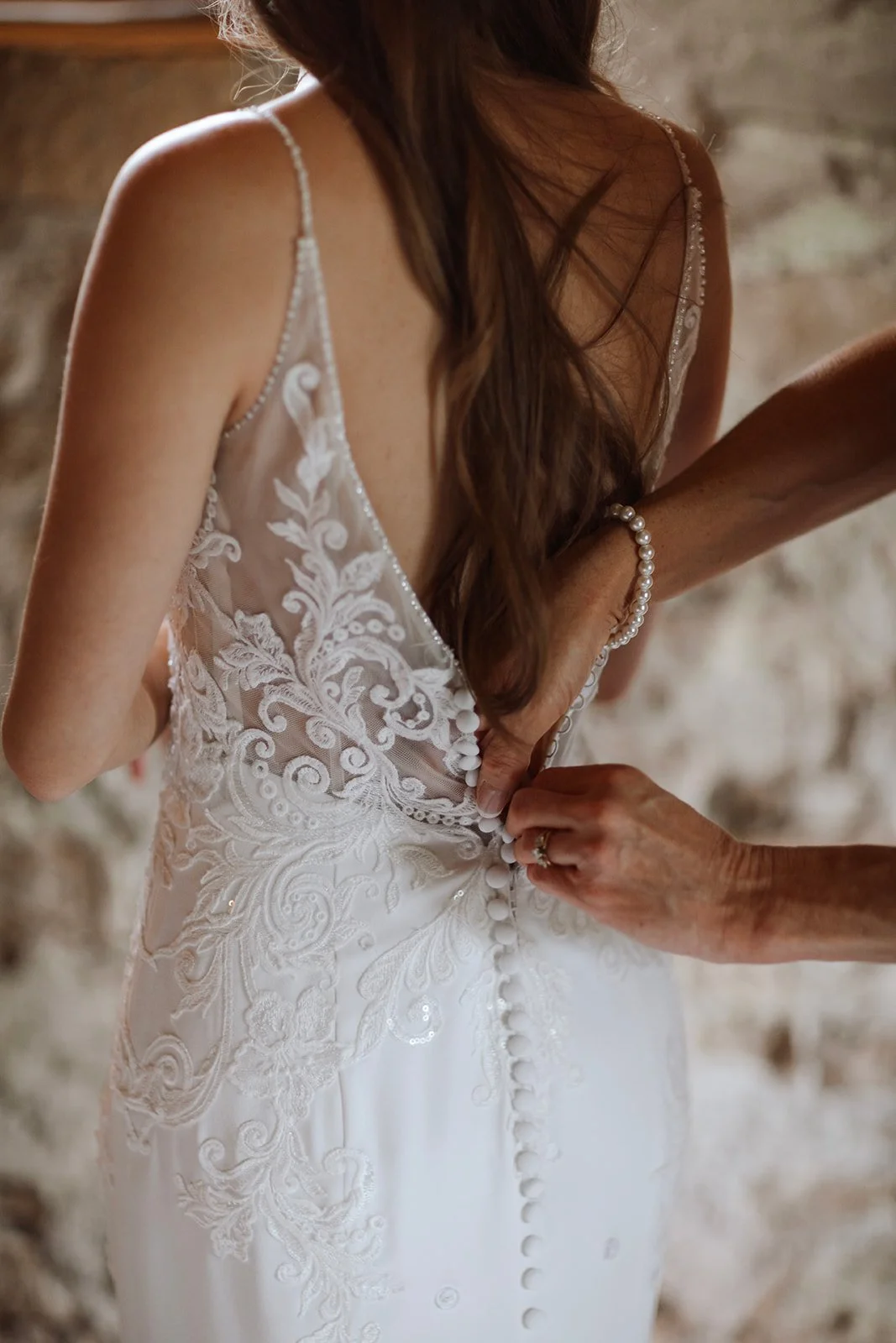 bride-getting dressed-lace-buttons