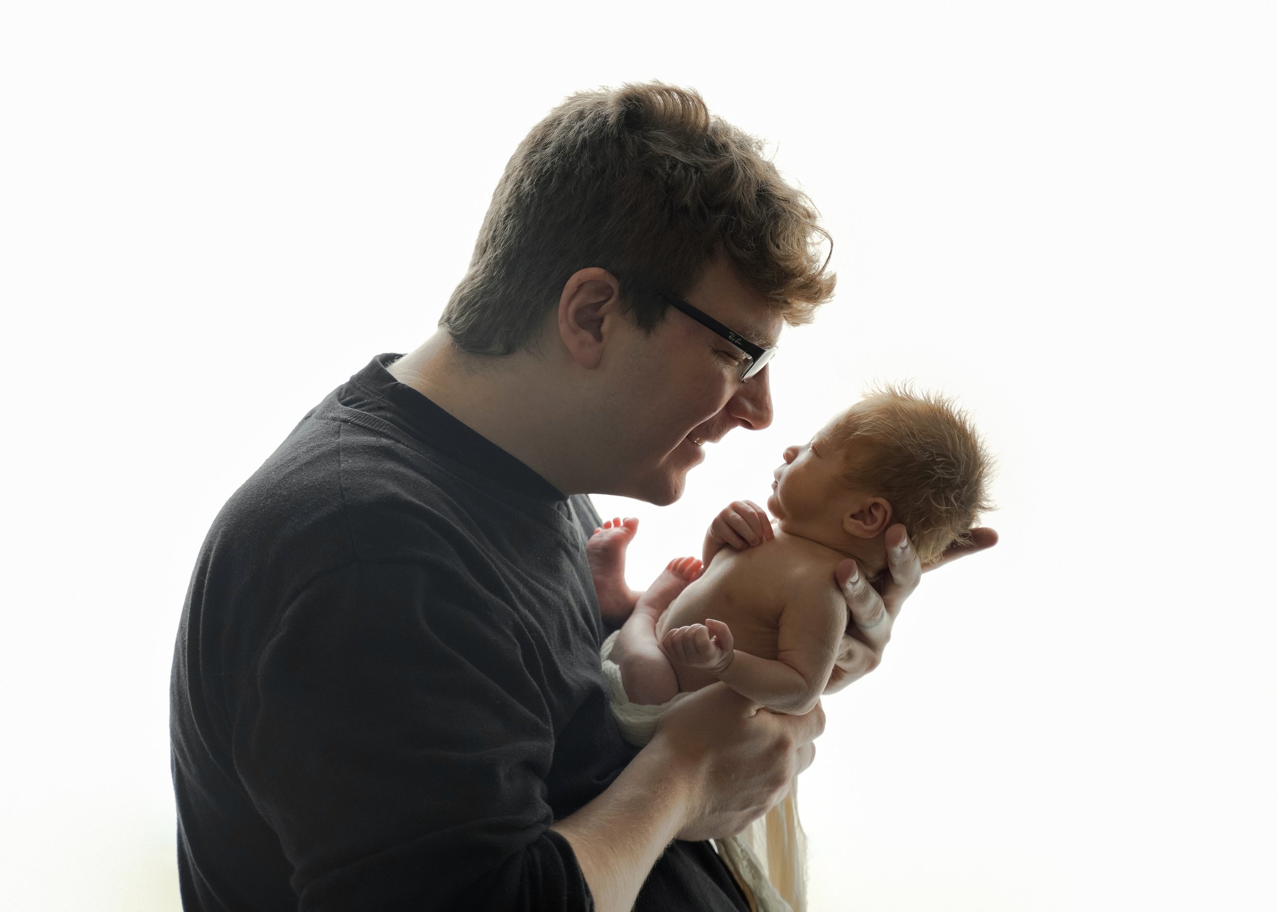 Dad and Newborn Baby Backlit