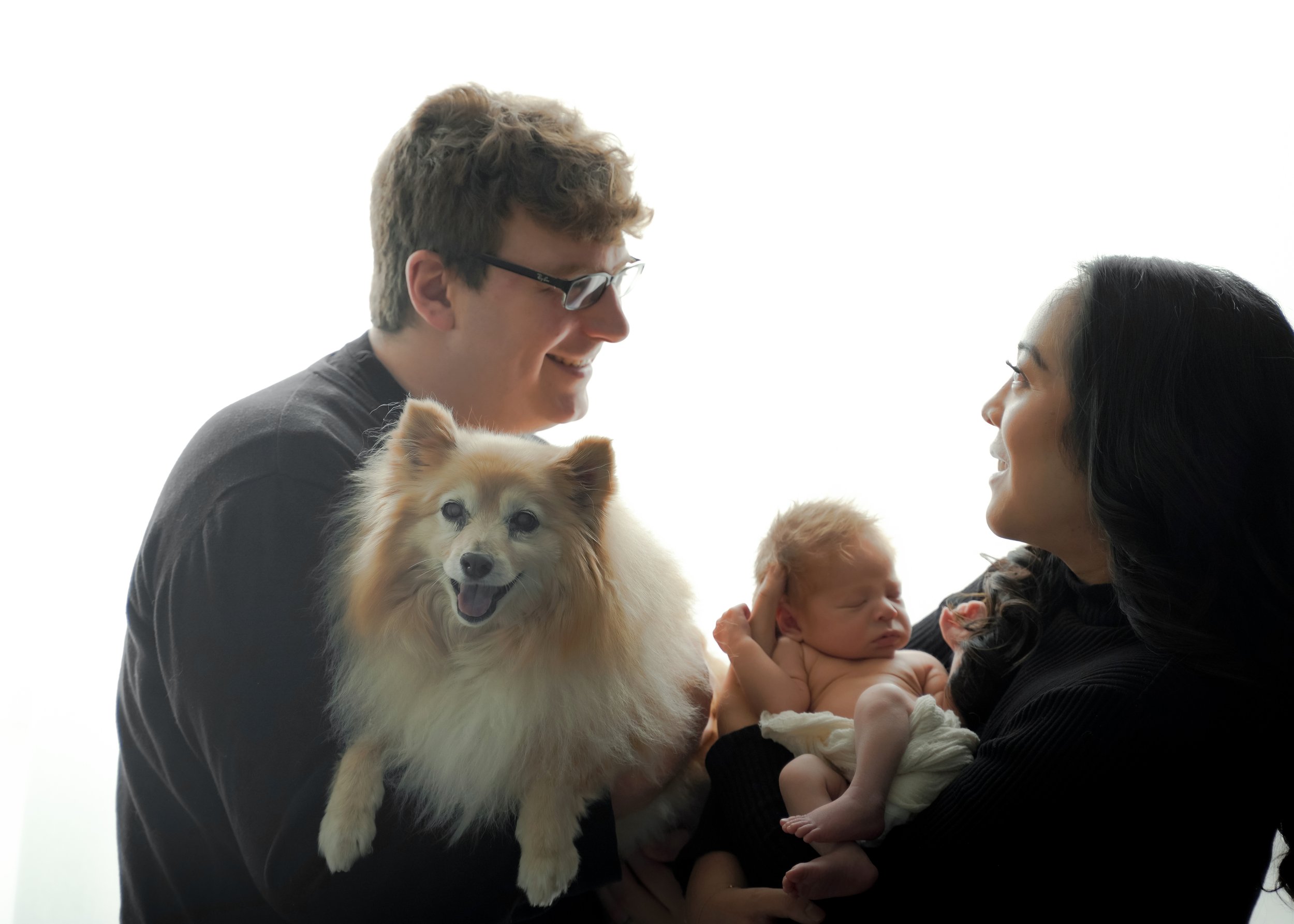 Newborn with Parents and Dog