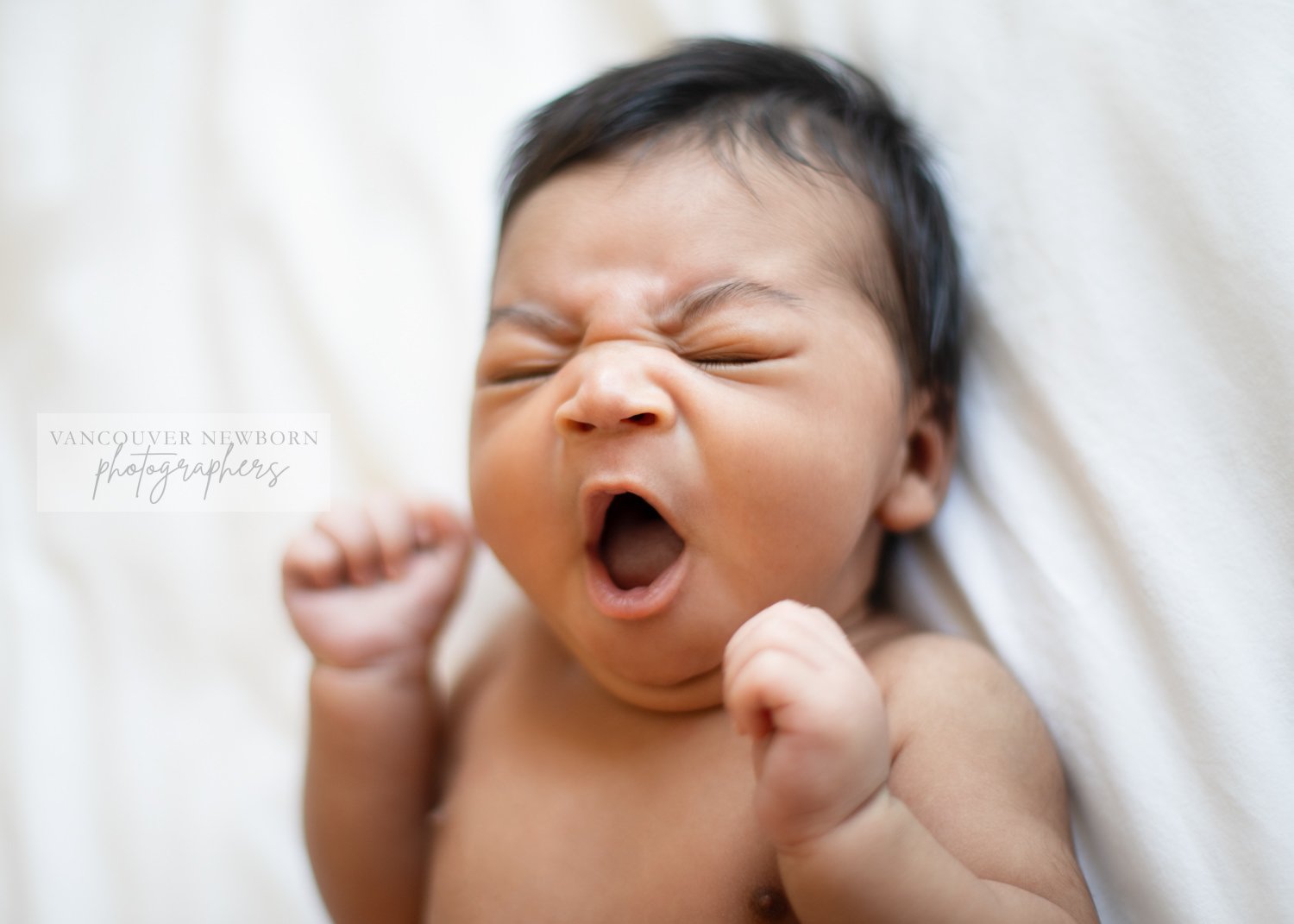 Yawning Newborn Baby 