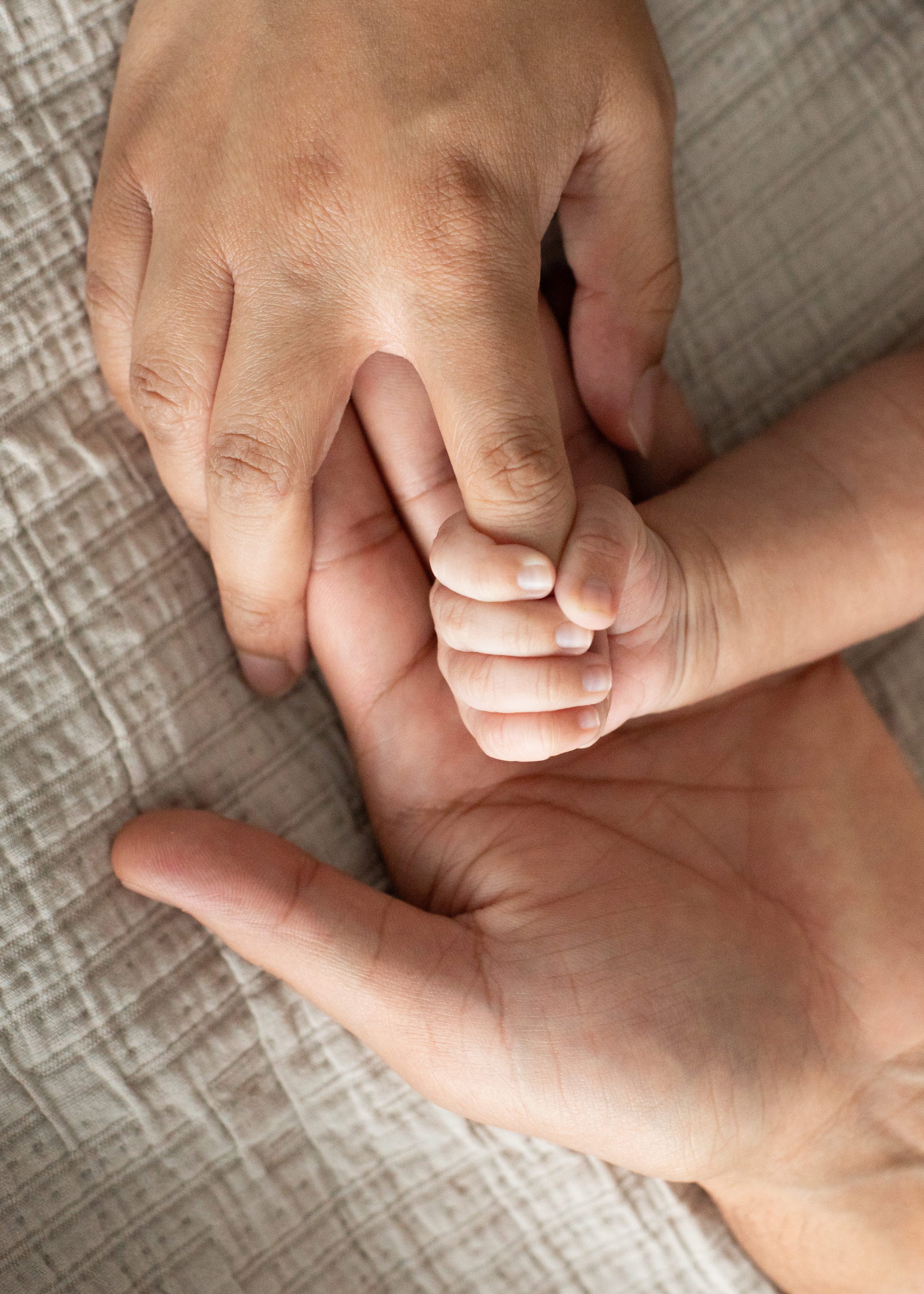 Newborn Holding Parents Finger