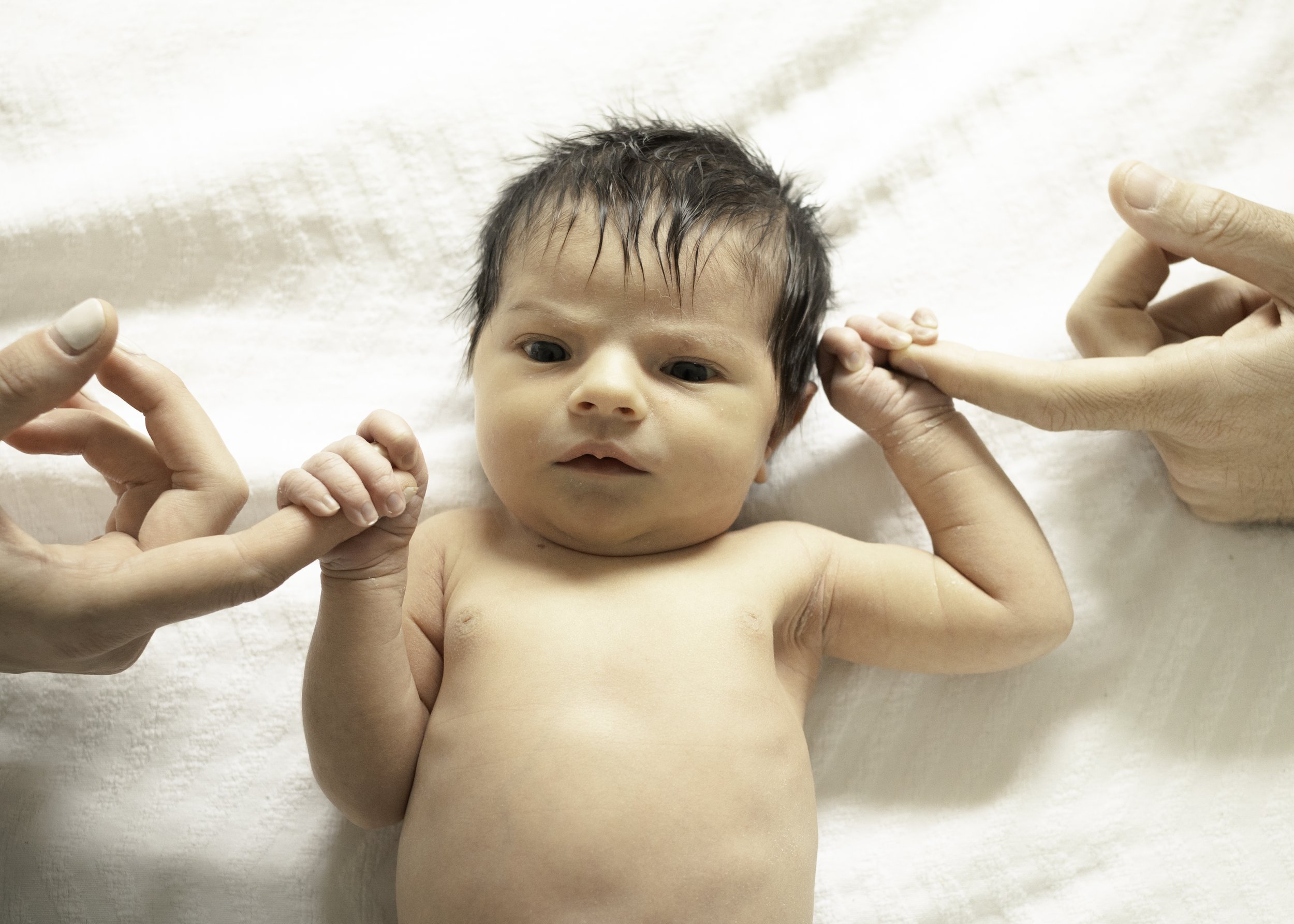 Newborn Holding Parents Fingers