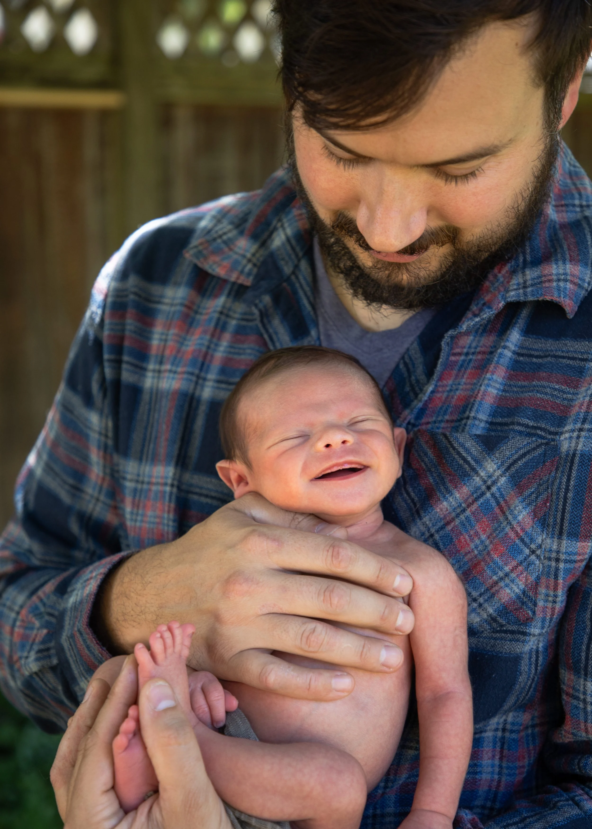 Dad Holding Smiling Baby