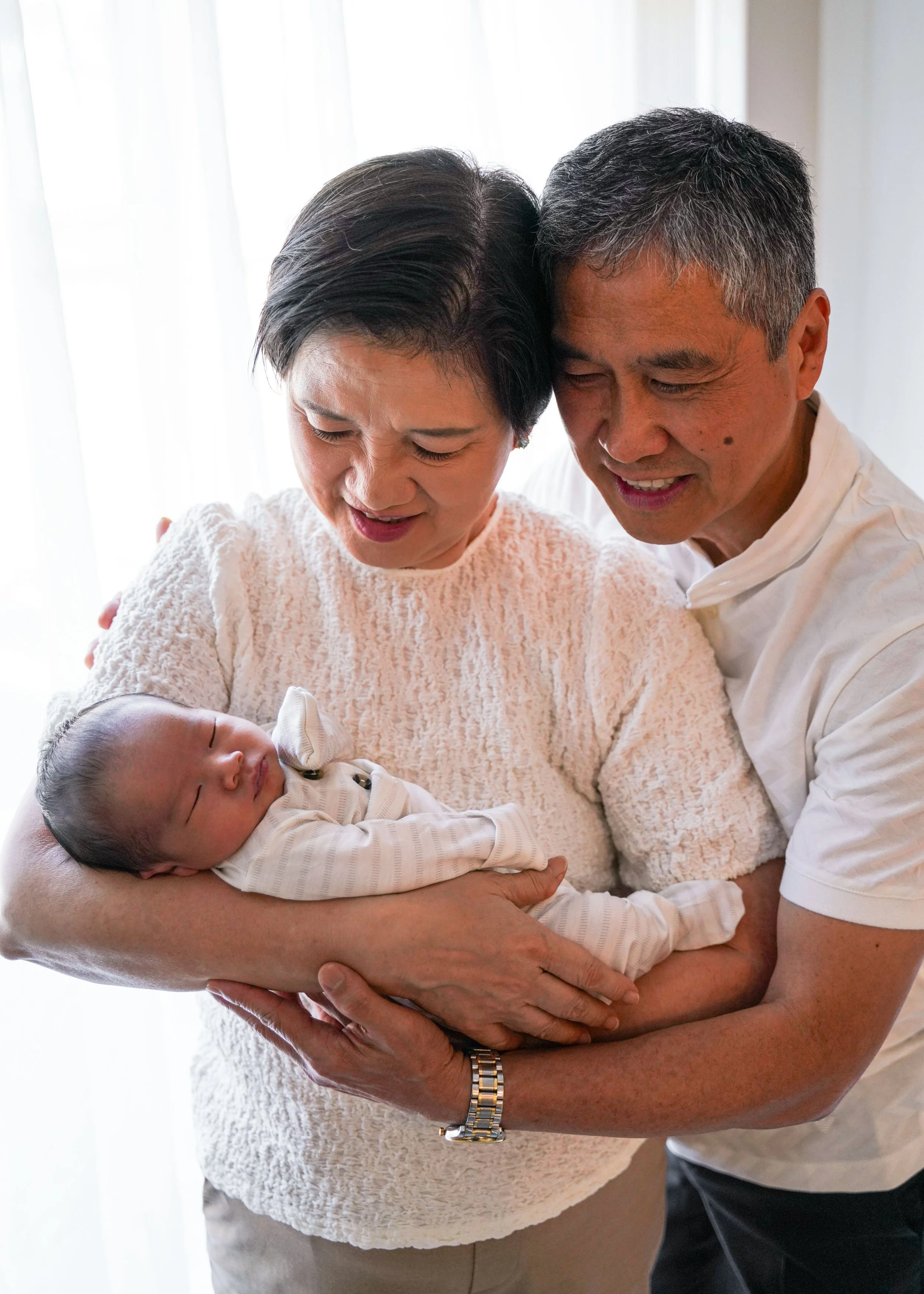 Newborn and Grandparents in Bedroom