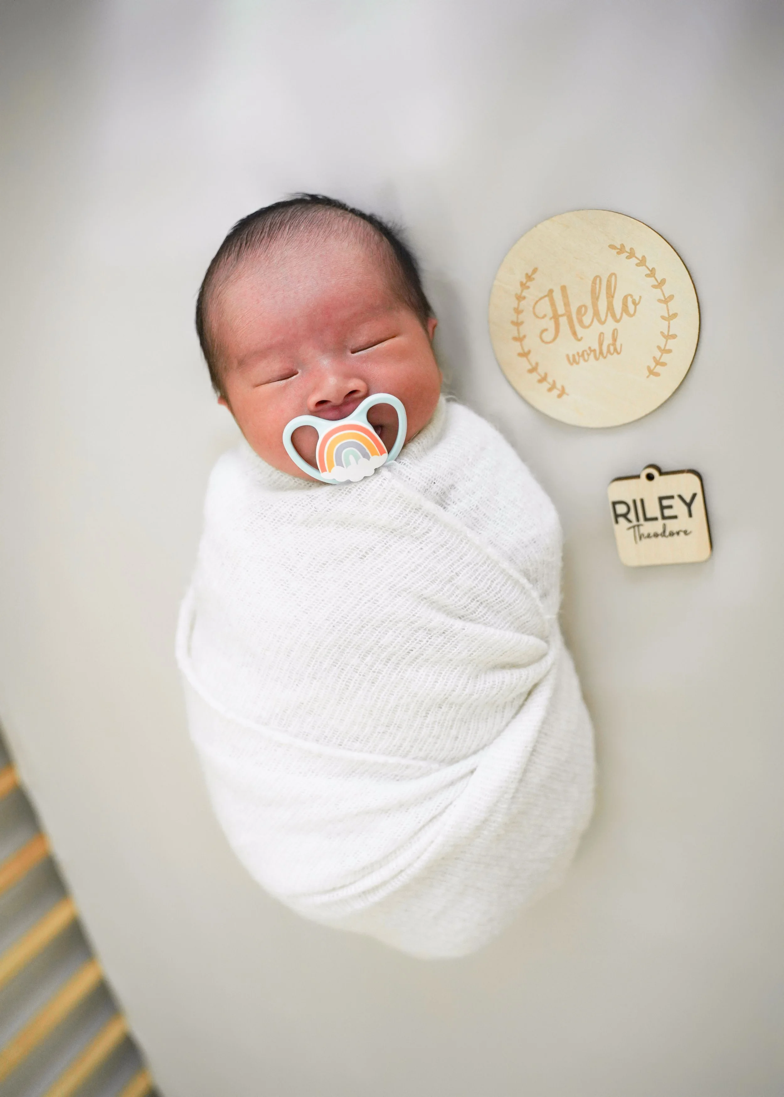 Wrapped Newborn in Crib