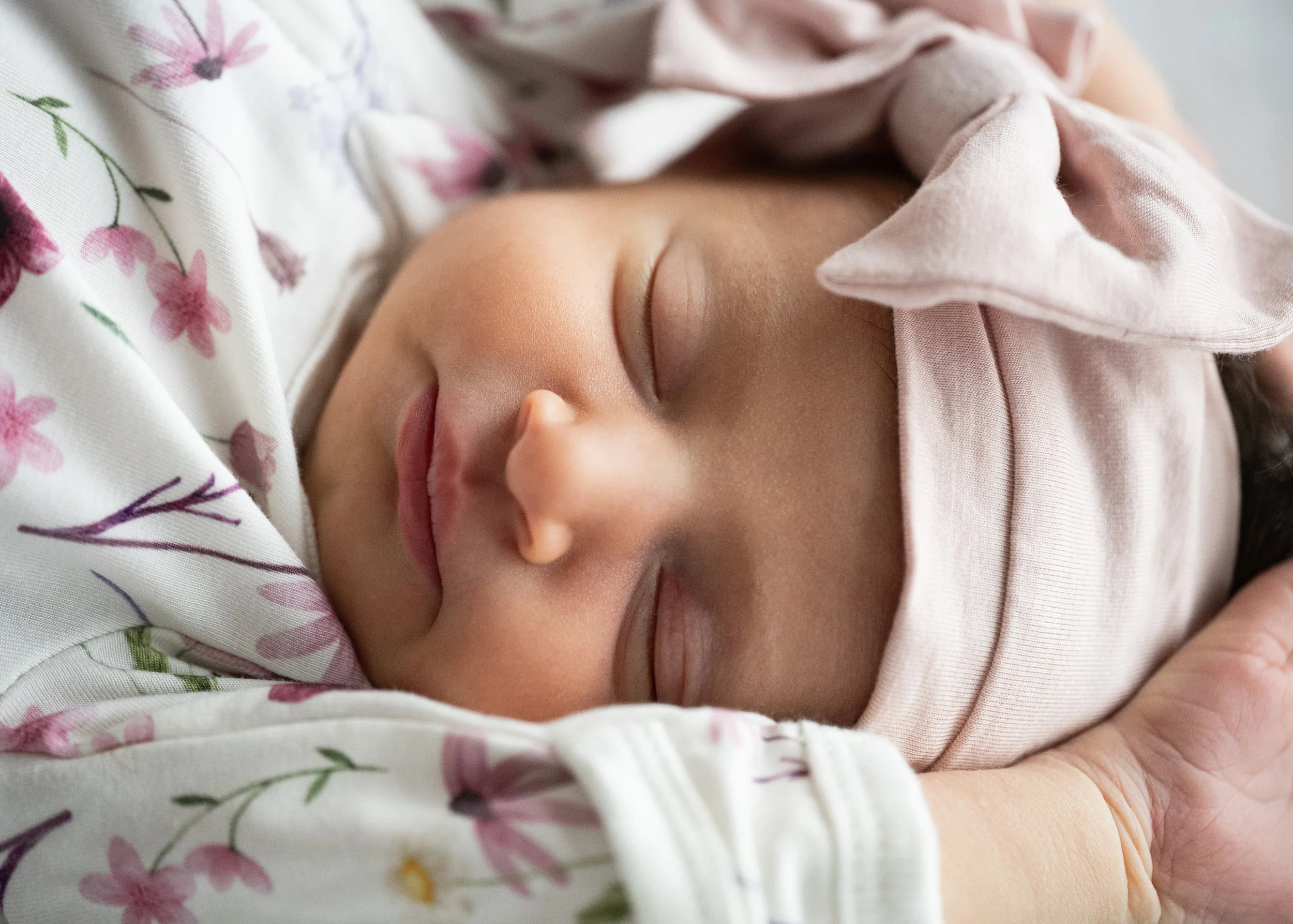 Newborn Girl with Pink Bow